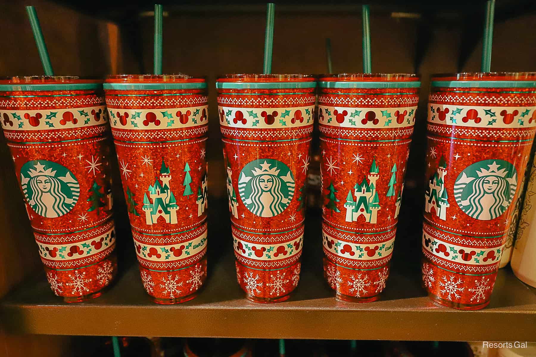 five Starbucks tumbler on display at Disney World 