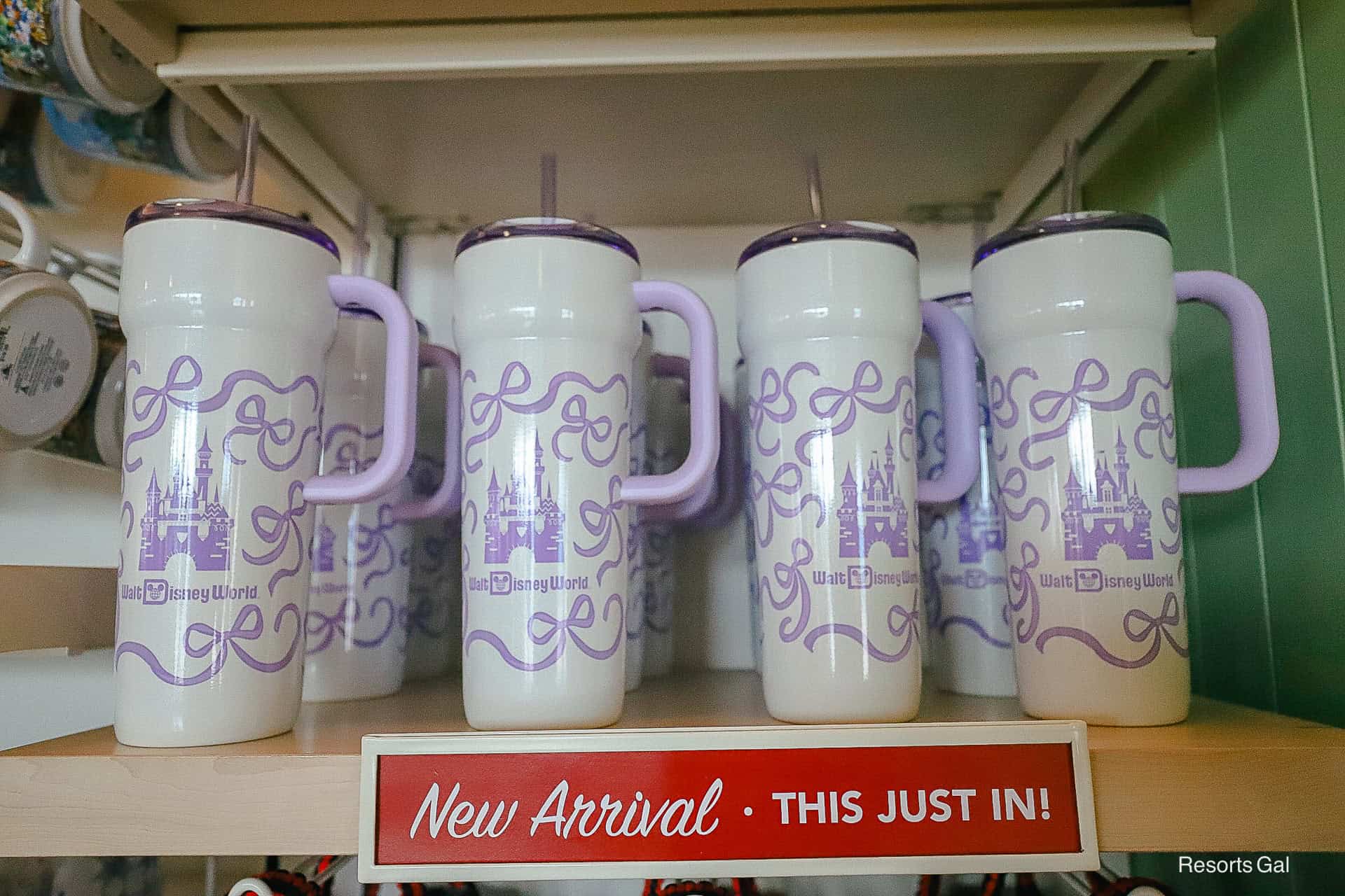 a sign with new arrivals featuring the Disney Starbucks Castle Bow Tumbler