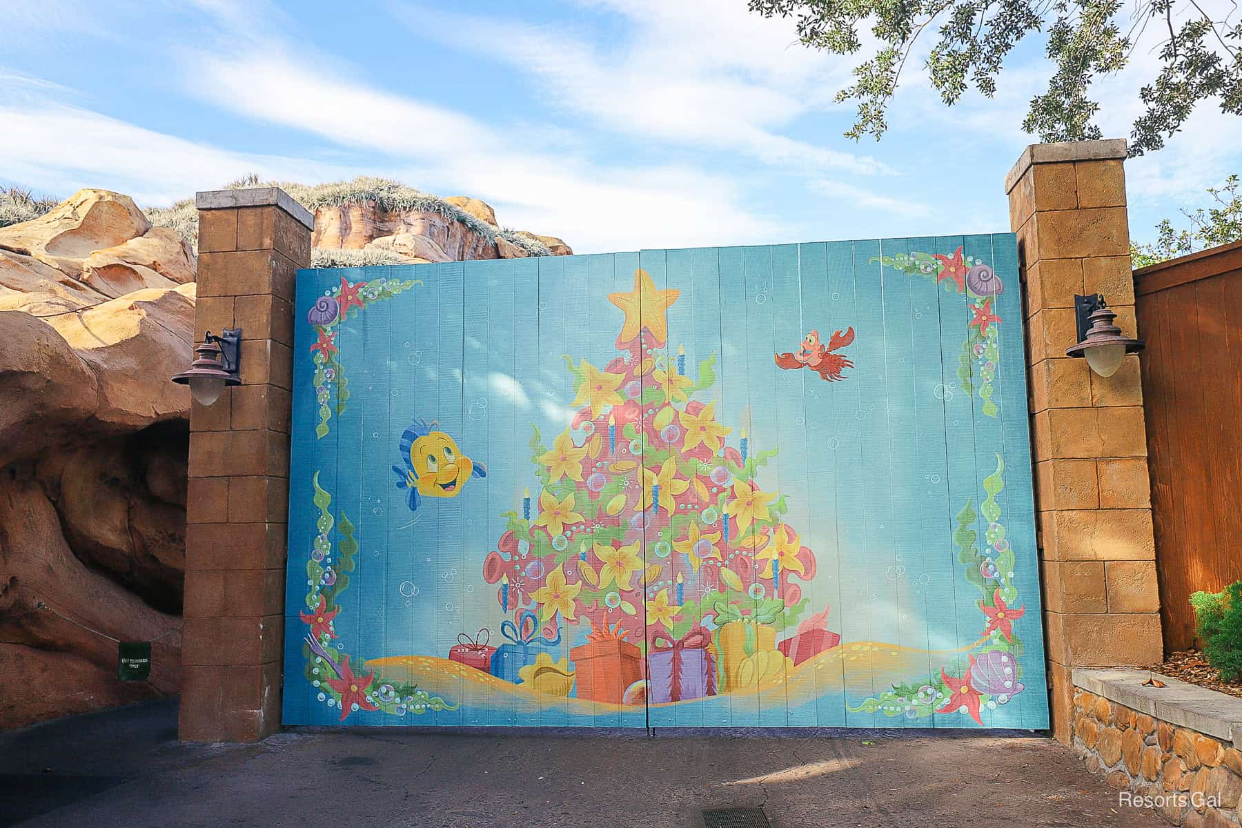 a Christmas mural with Flounder and Sebastian from The Little Mermaid