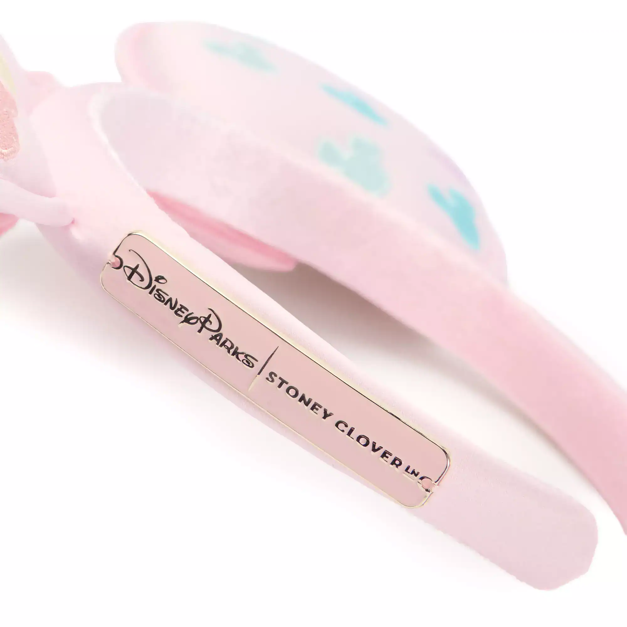 the Stoney Clover Lane plate on the side of the ear headband 