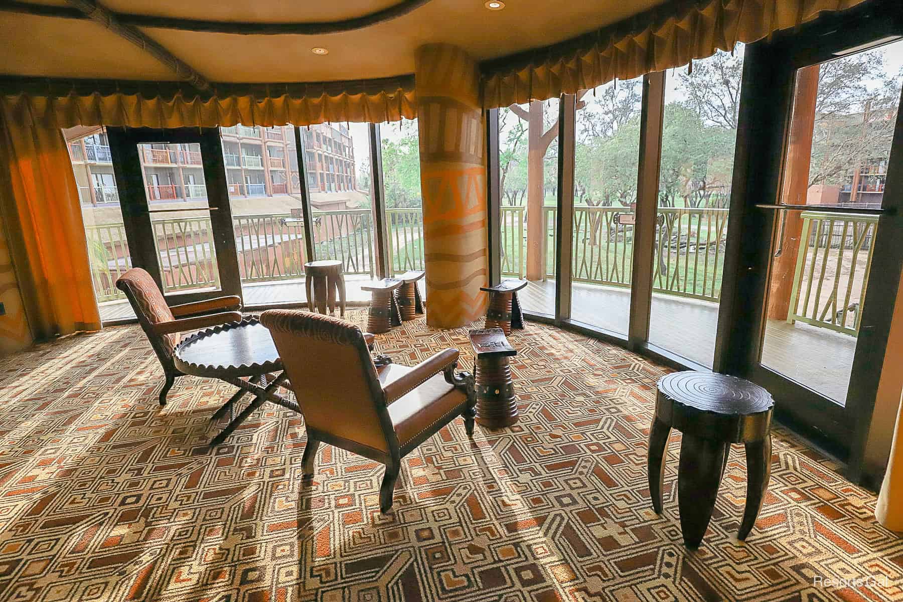 a view of the Sunset Savanna from inside the Overlook Lounge