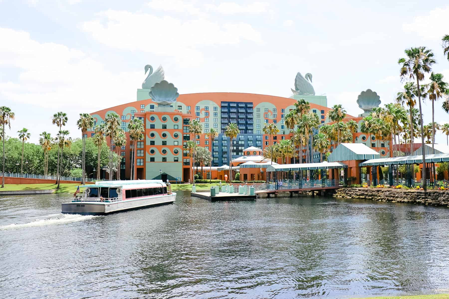 A Friendship boat pulling up to the dock. 