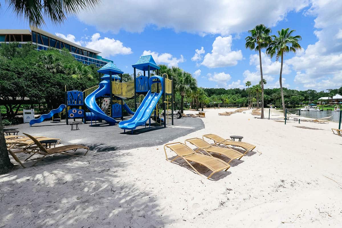 a playground on a white sand beach 
