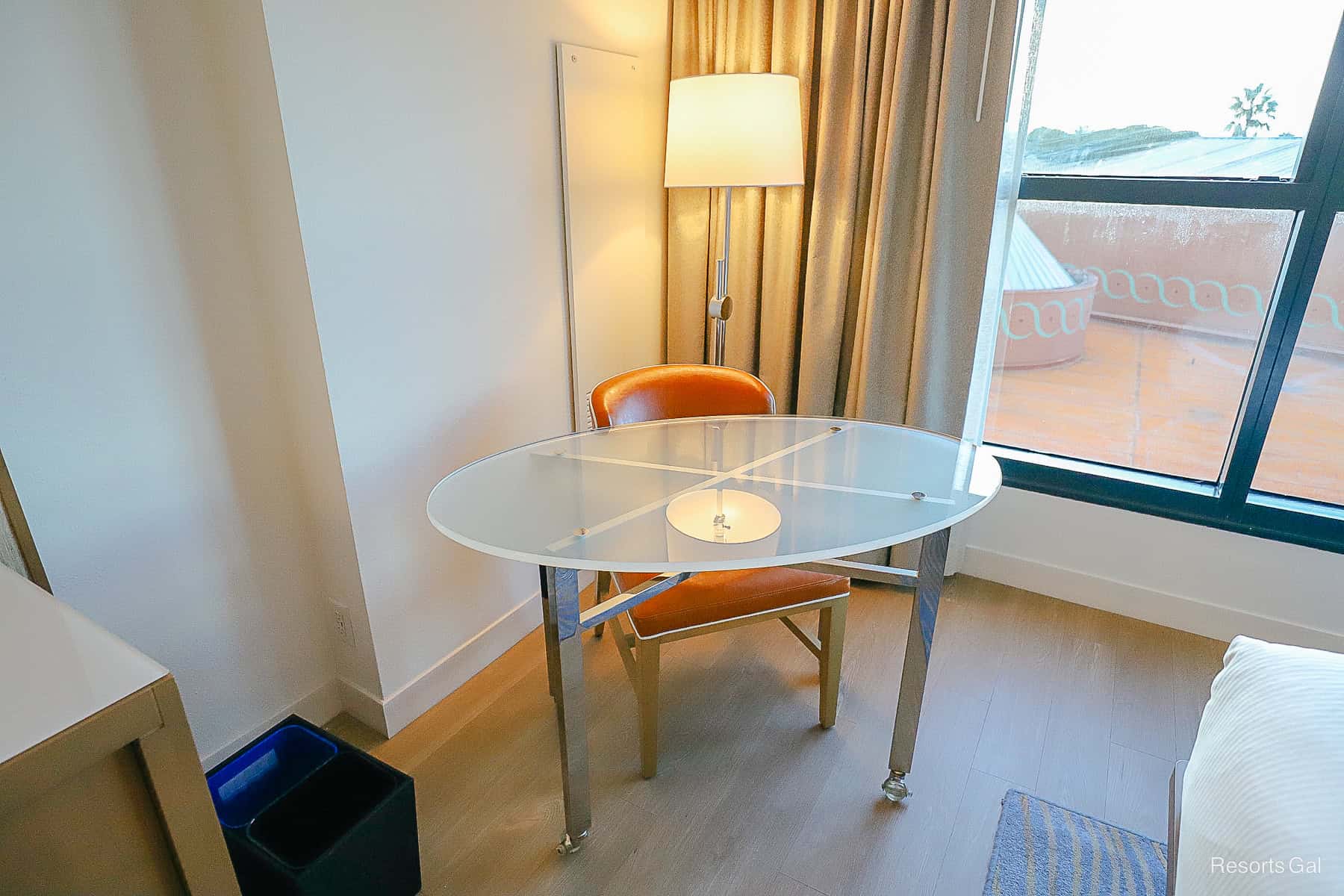 a table on rollers with a chair 