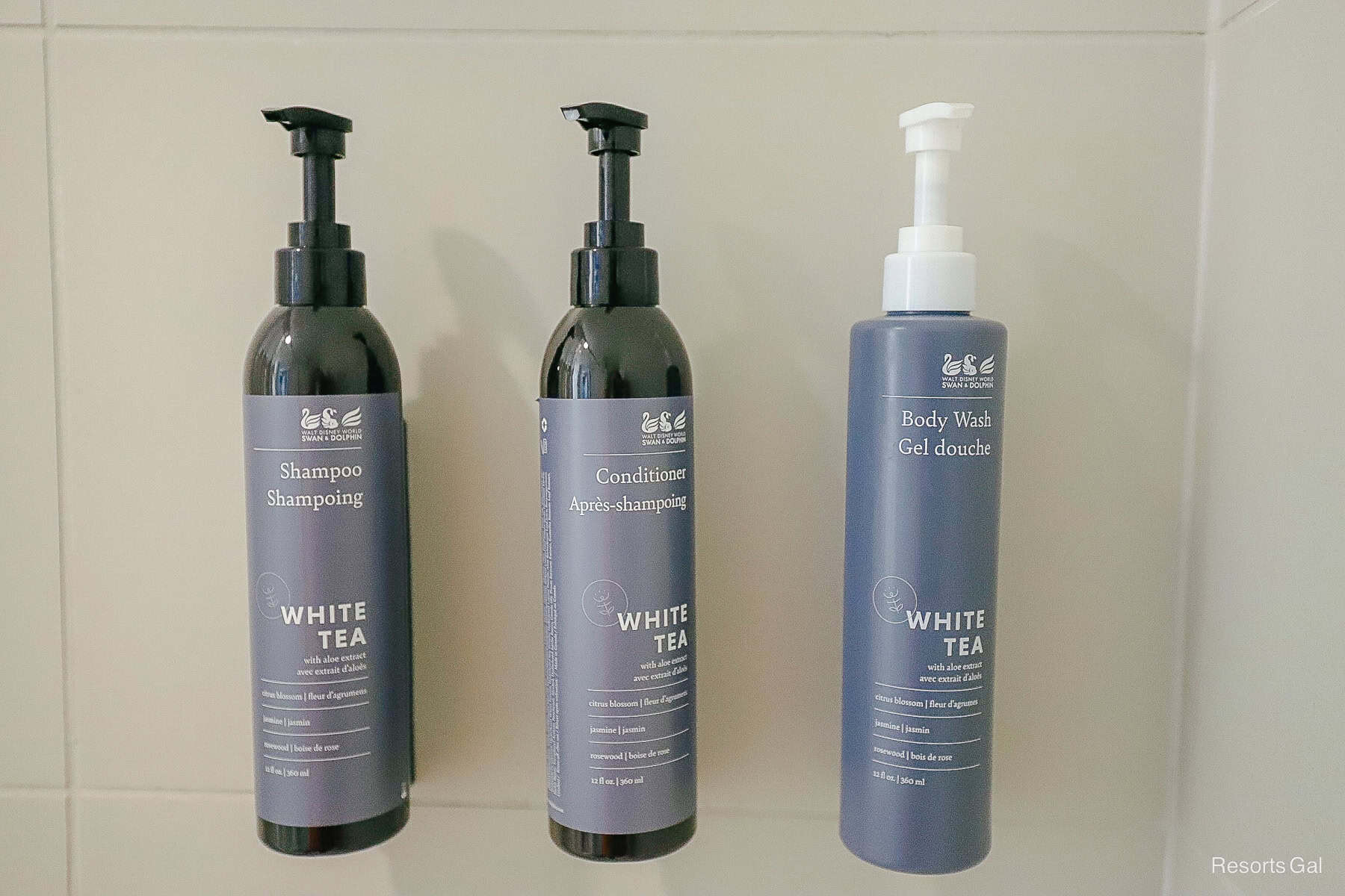 a trio of shampoo, conditioner, and body wash built-in on the back of the shower area 