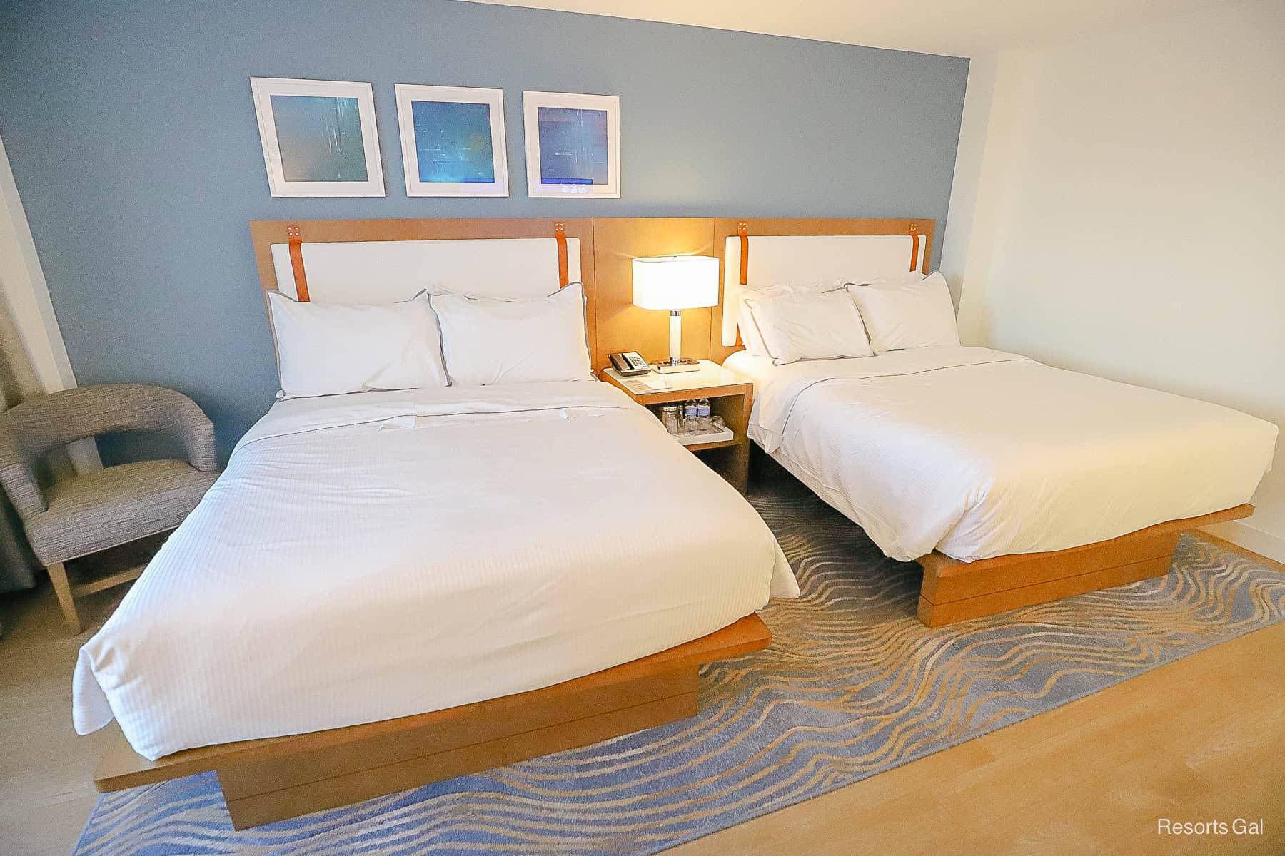 two queen beds with simple white linens 
