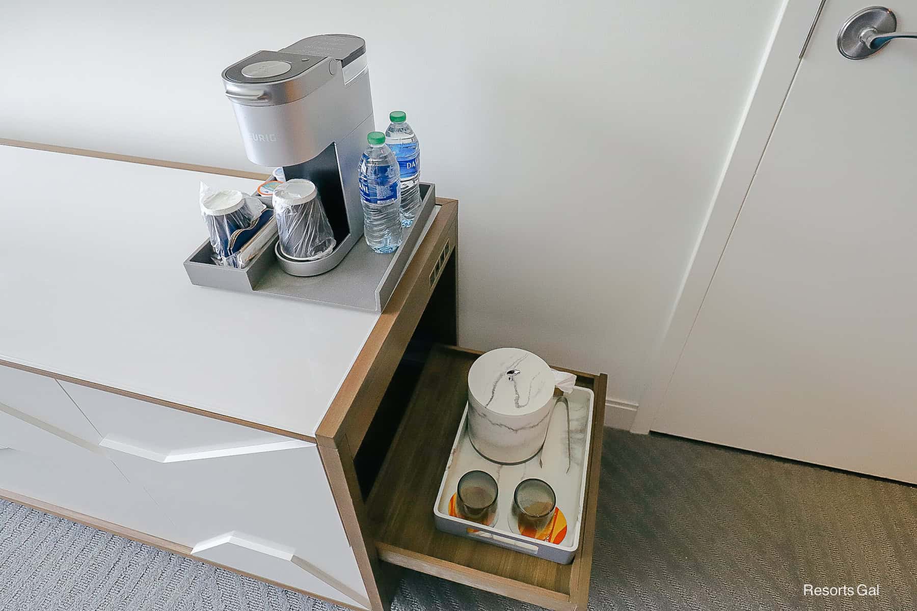 a beverage station on top of the dresser