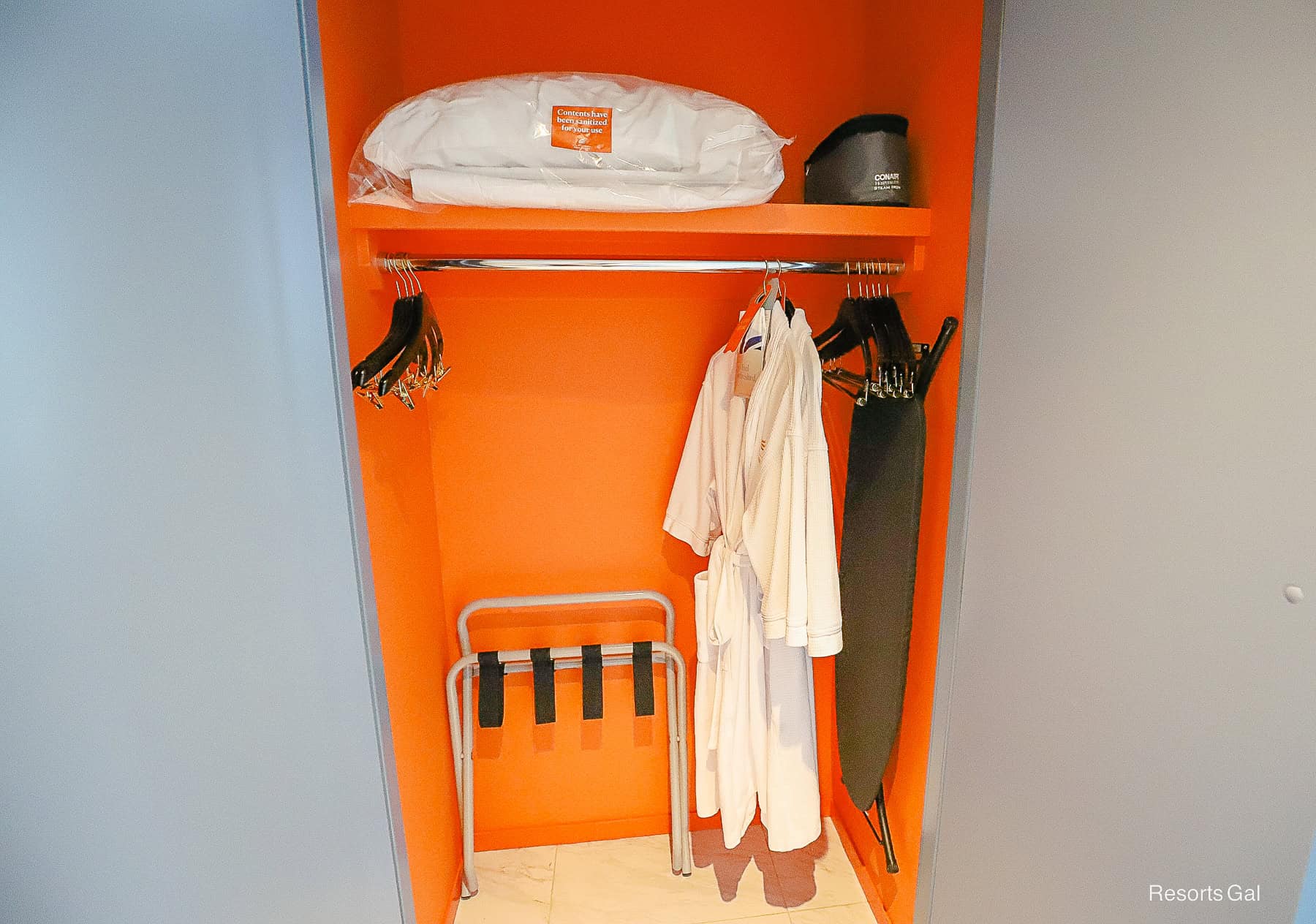 robes and other amenities hanging in the room closet