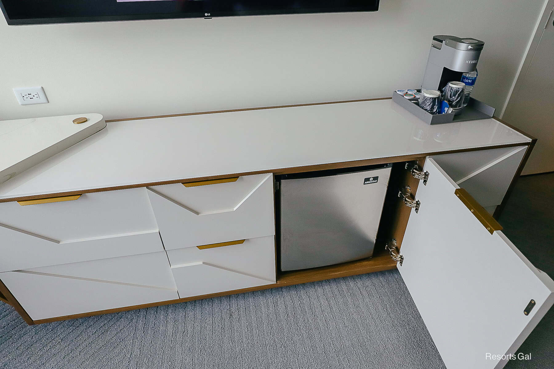 a long dresser with storage space
