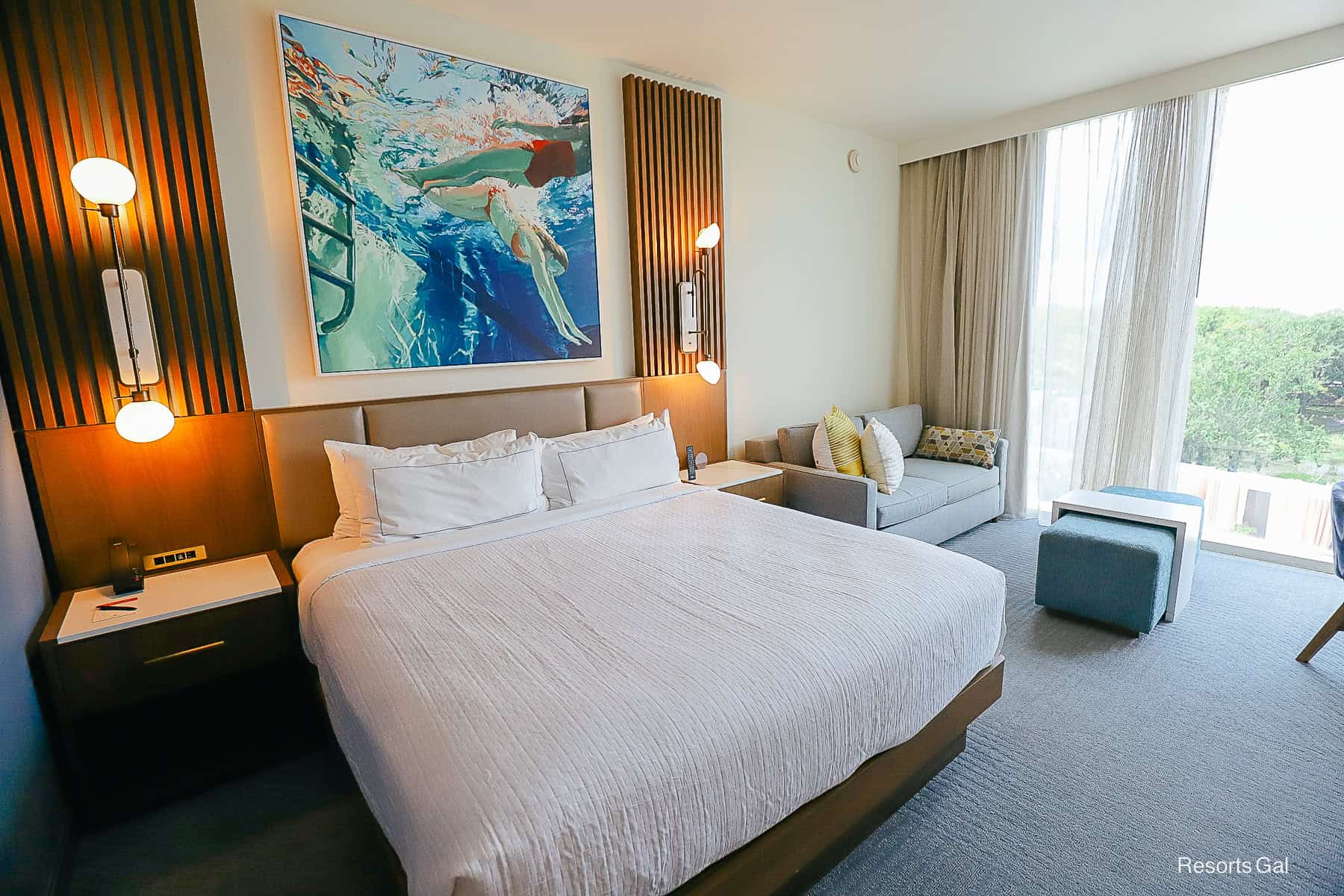 a king size bed that's attached to the wall with a leather headboard
