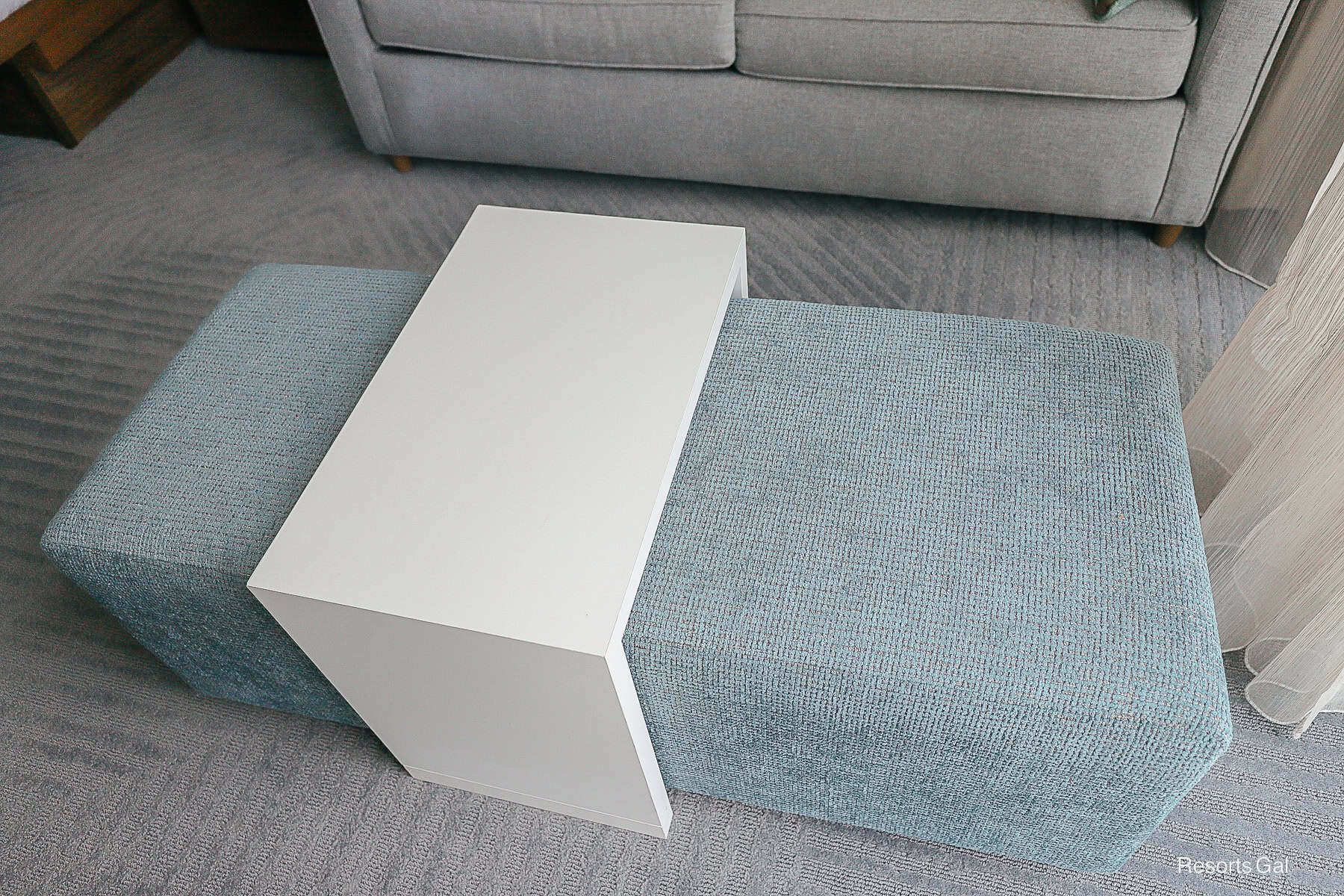 a light blue ottoman with a white tray