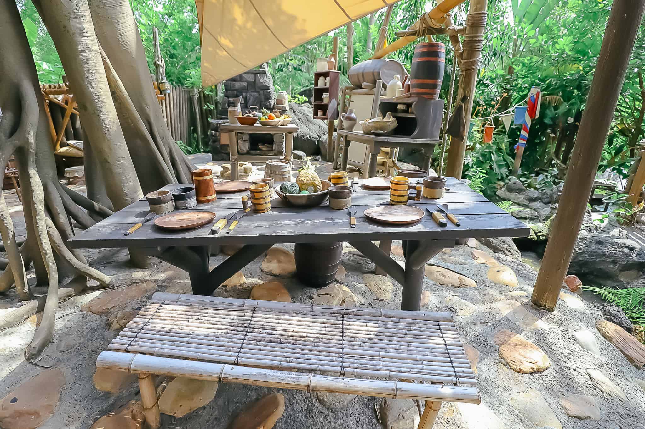 Dining table with benches made from bamboo and other items made by the Swiss Family Robinson. 