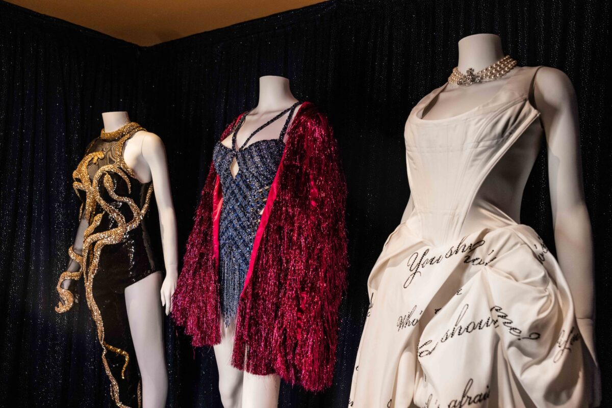 a collection of Taylor Swifts Eras Tour costumes at Disney's Hollywood Studios