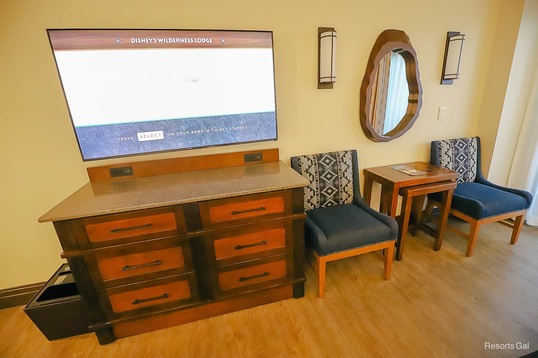 a television at Disney's Wilderness Lodge guest room with a dresser and outlets 