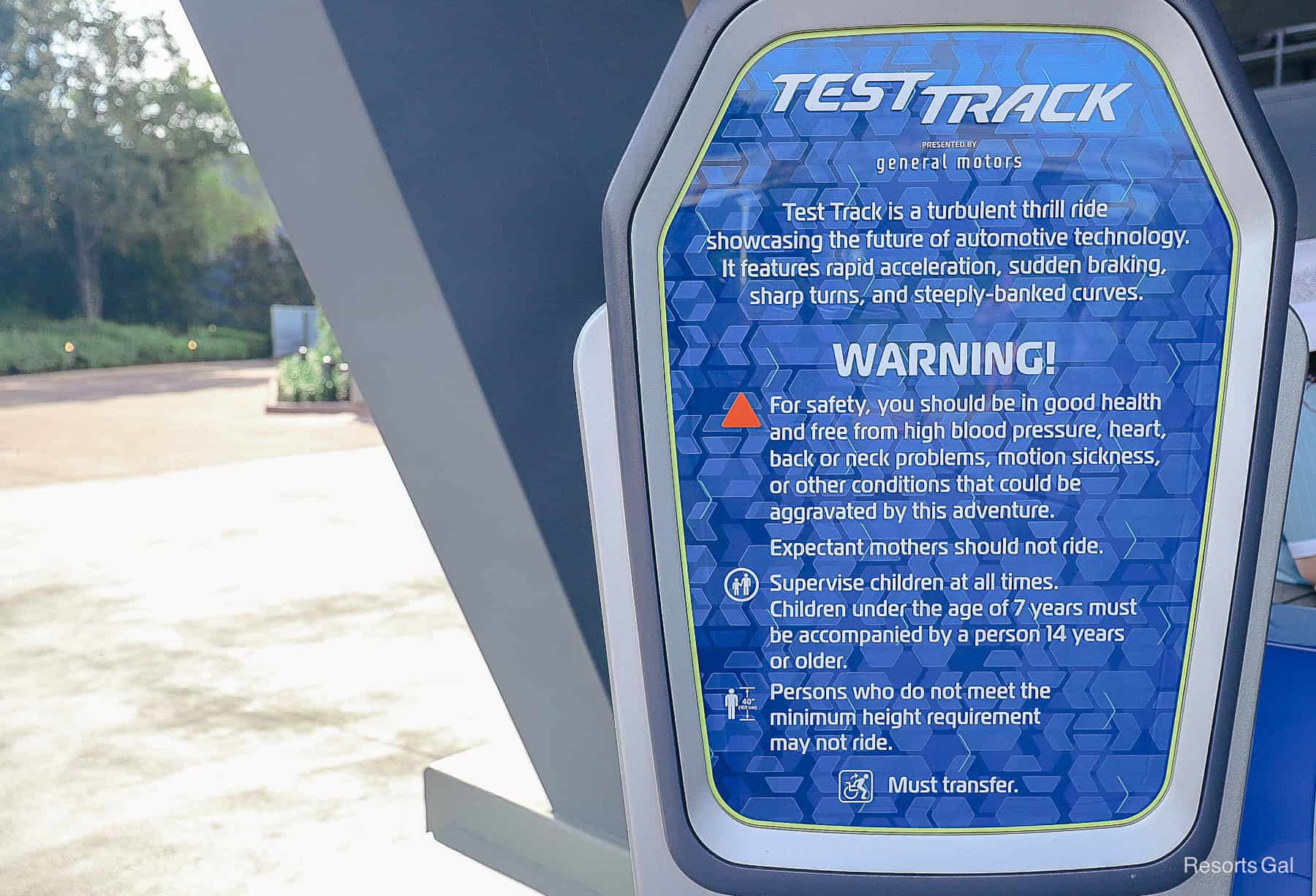 a sign with ride warnings and rules for experiencing Test Track 