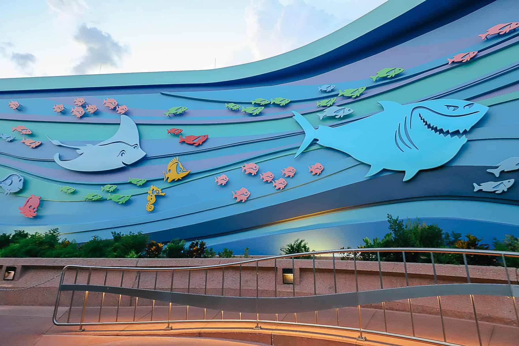 Giant fish cut-outs decorate the exterior of The Seas ride. 