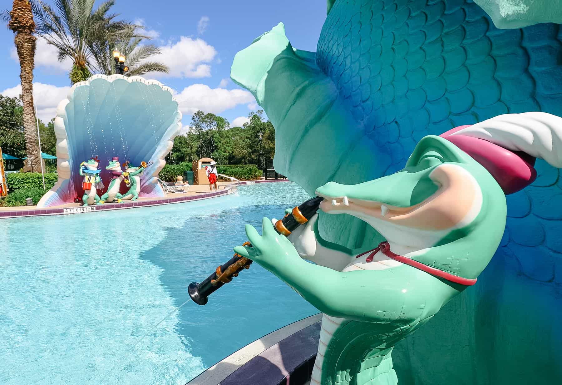 Alligator playing a clarinet at Port Orleans French Quarter Pool. 