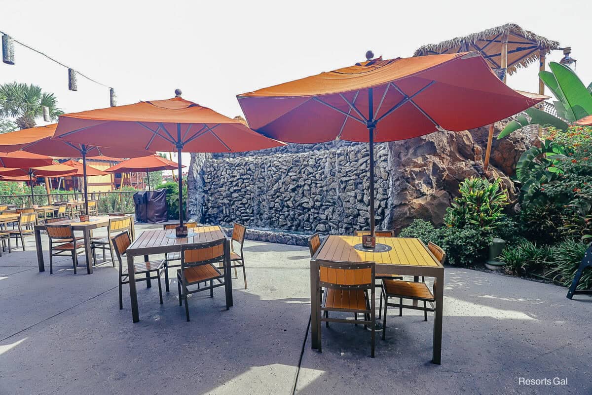 a set of tables and chairs on the patio at Trader Sam's Tiki Terrace