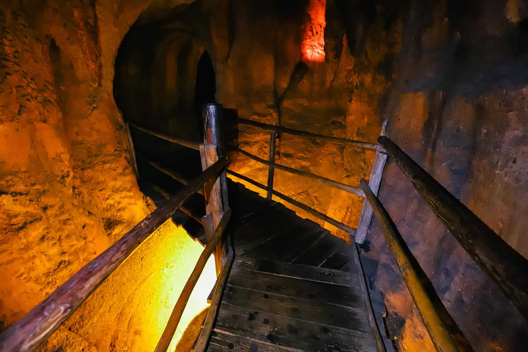 a wooden walkway inside the bridge