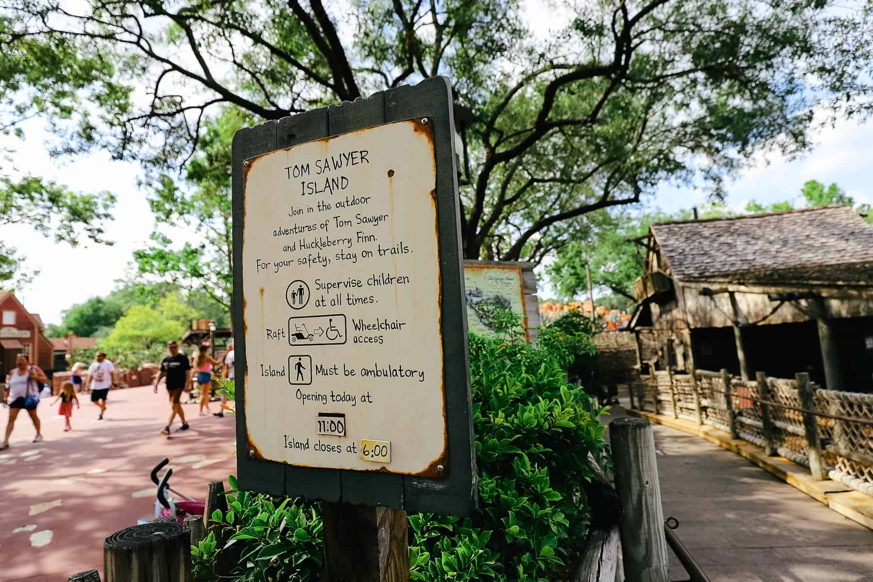 posted ride rules and hours of operation for Tom Sawyer Island 
