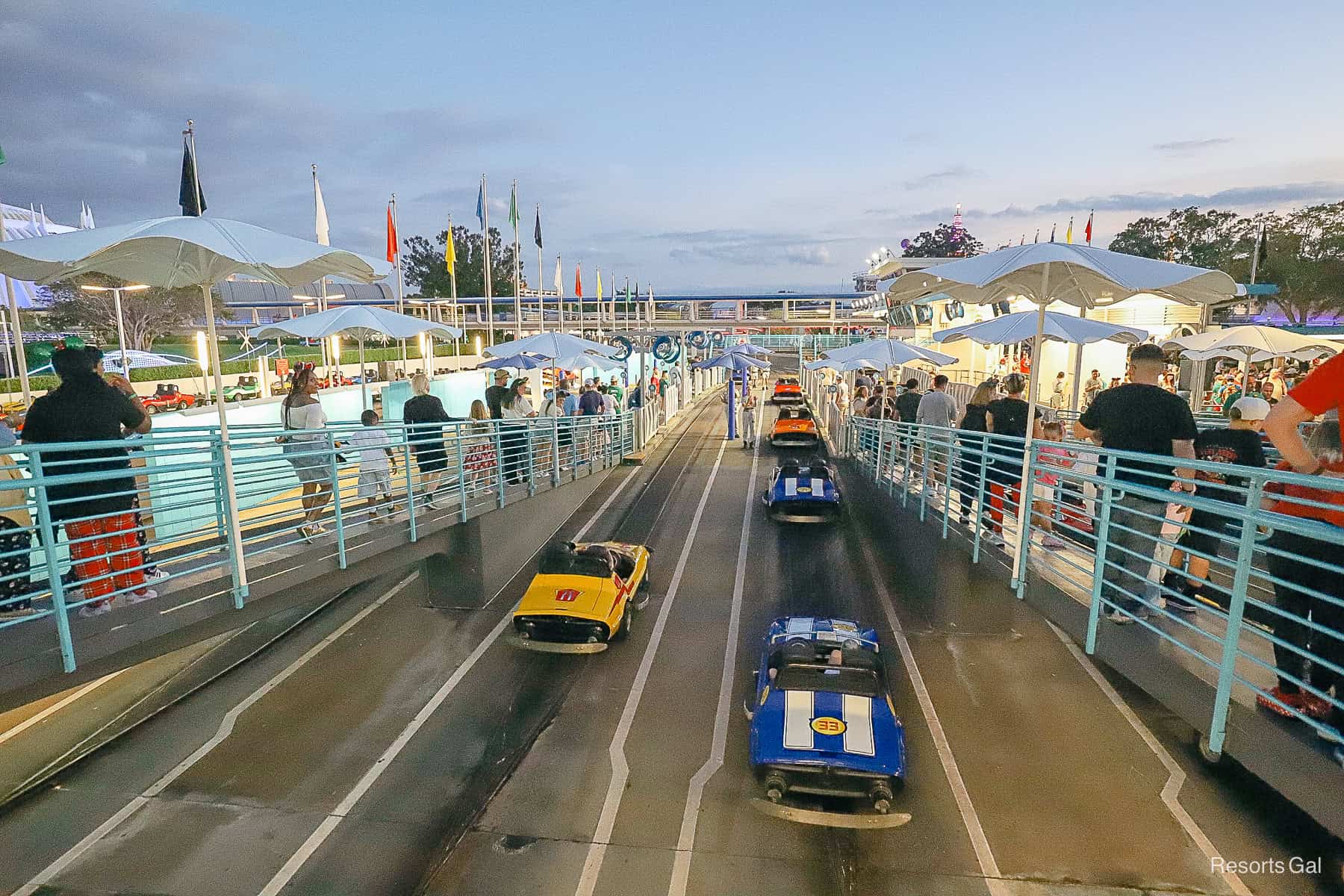 guests boarding cars at the Tomorrowland Speedway