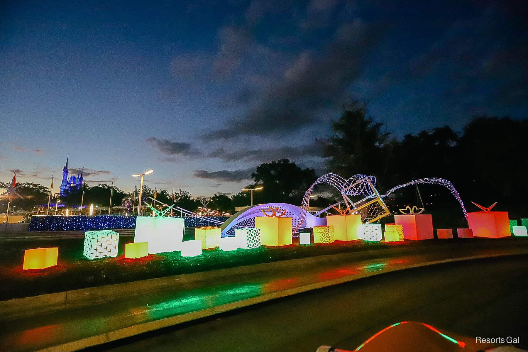 a row of Christmas lights on the Tomorrowland Speedway