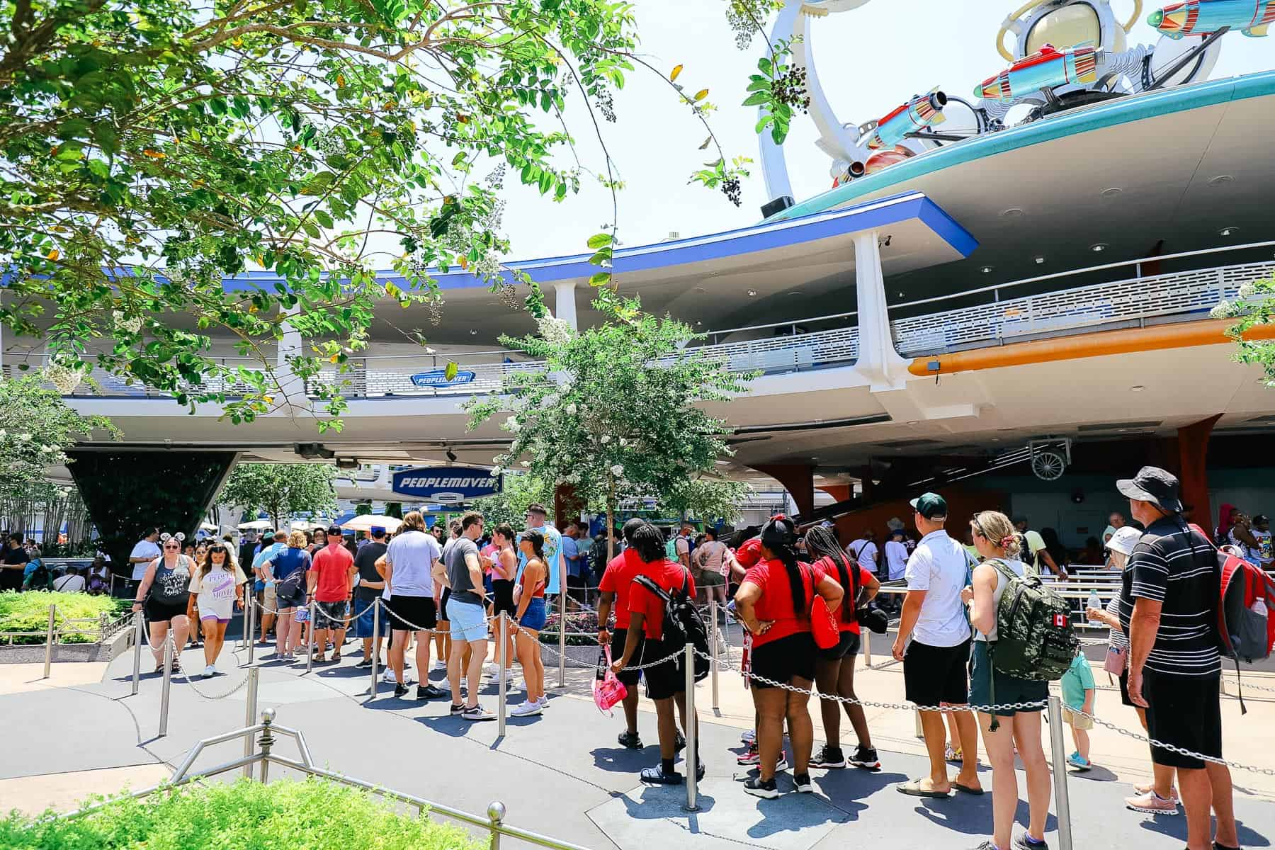 A line of guests waiting to ride the Peoplemover. 