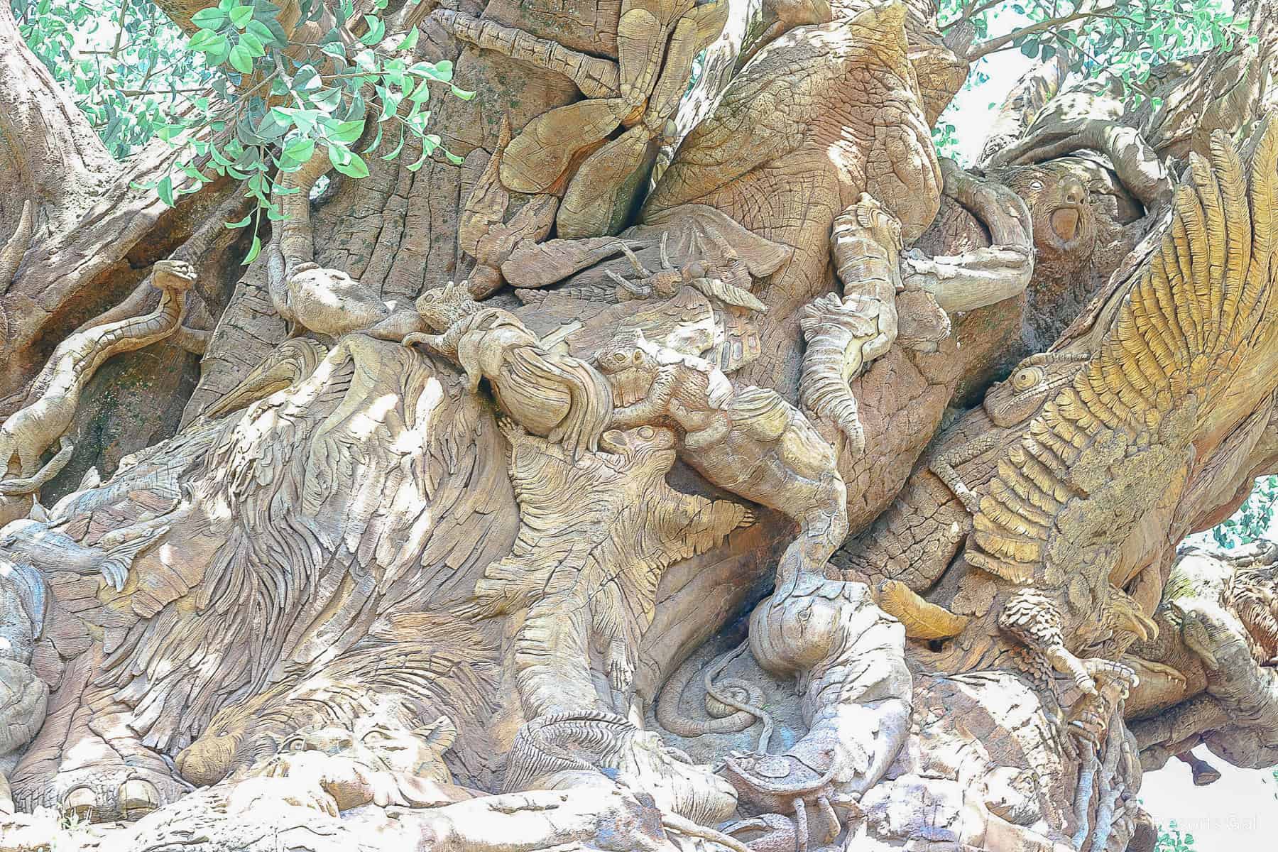 carvings with a seahorse, squirrels and a hawk and many others on the Tree of Life 
