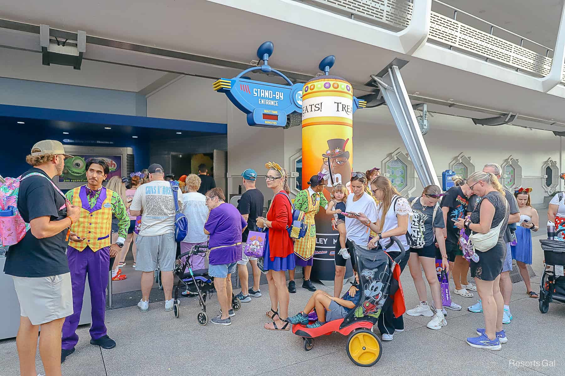 guests at a Trick or Treat Trail in Tomorrowland at Magic Kingdom