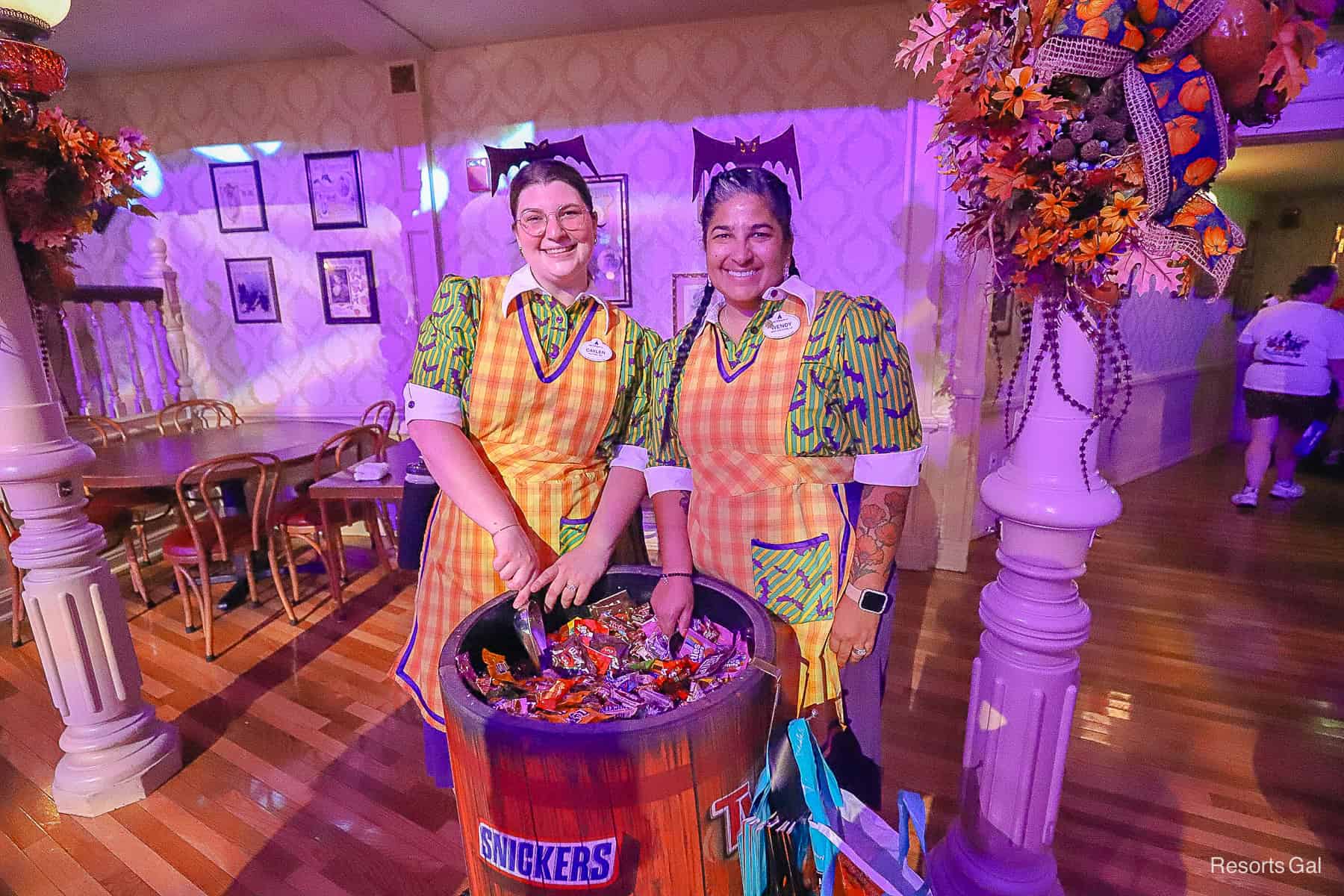 Cast members handing out candy at Mickey's Halloween Party 