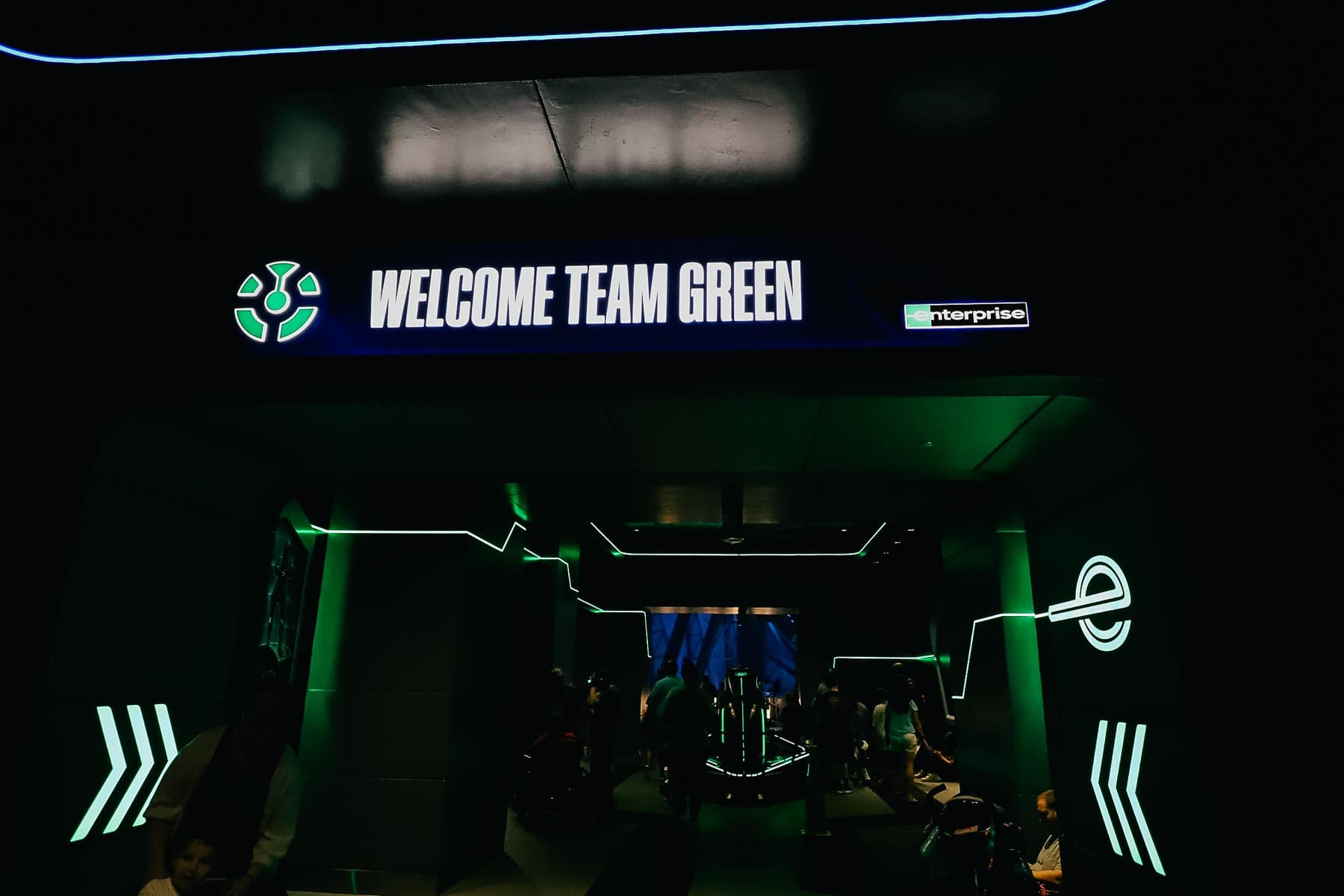 Welcome Team Green sponsored by Enterprise sign at the end of Tron. 