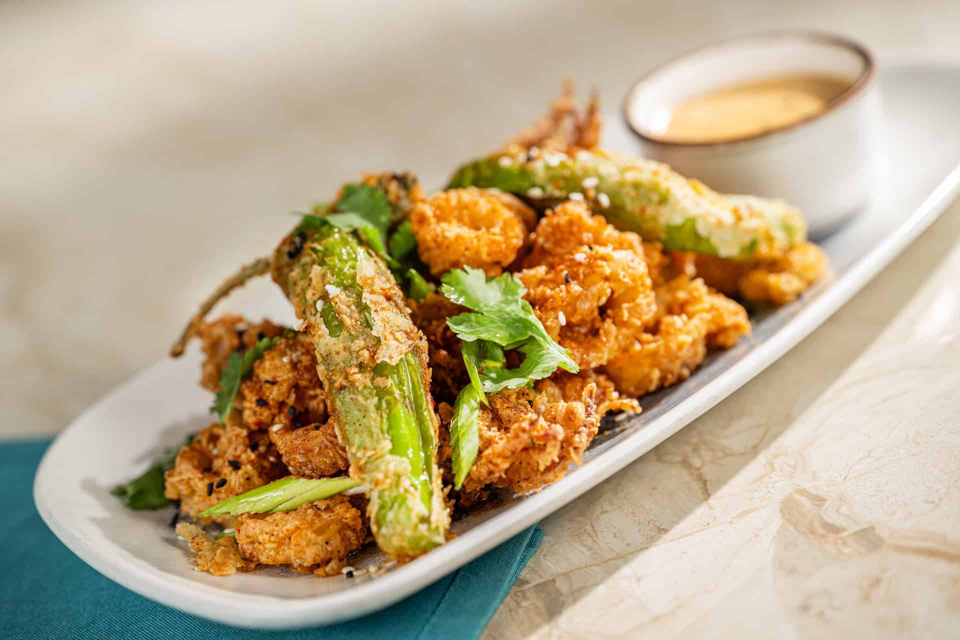 an order of golden-fried calamari from the Turf Club Bar and Grill