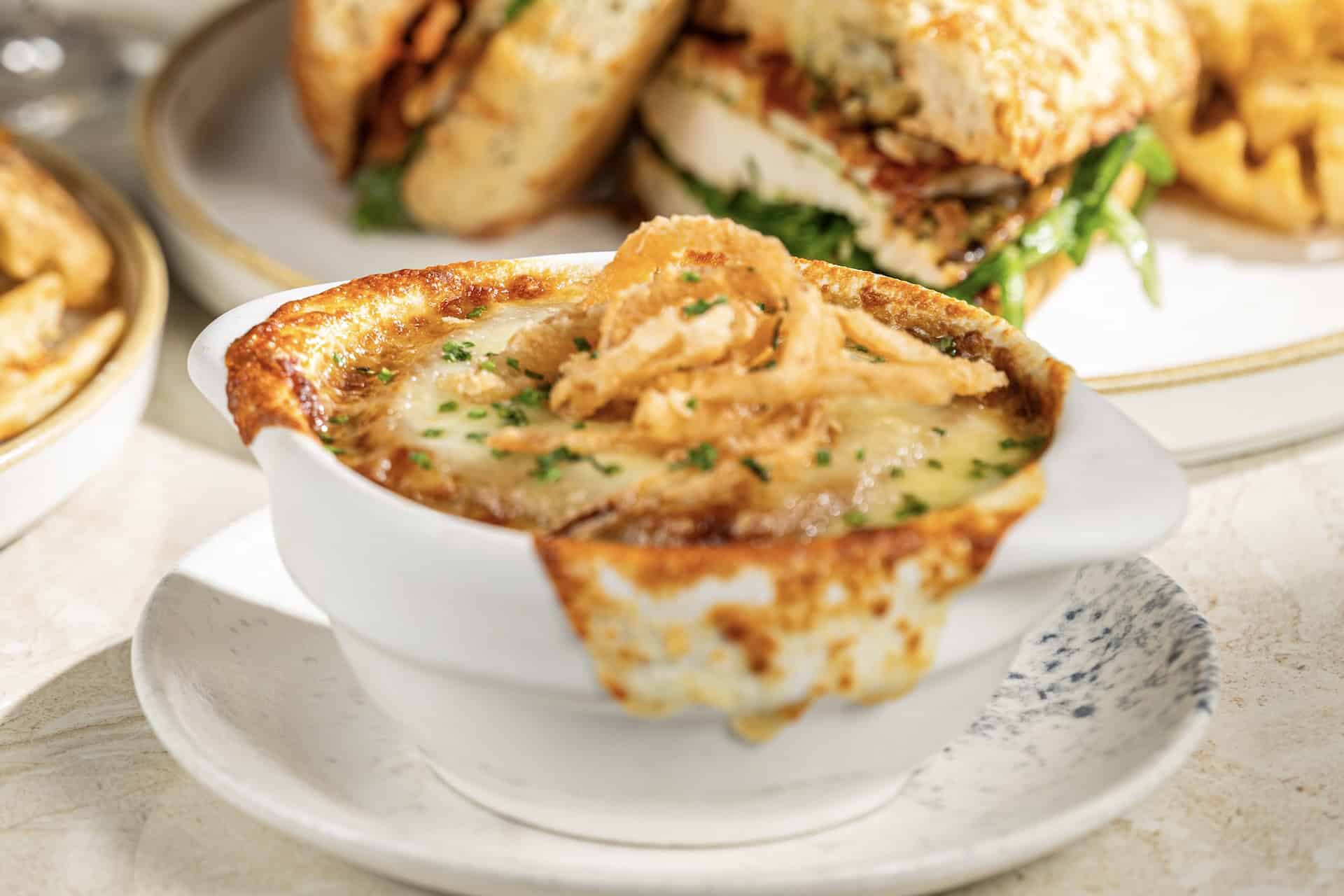 an order of French Onion soup from the Turf Club Bar and Grill