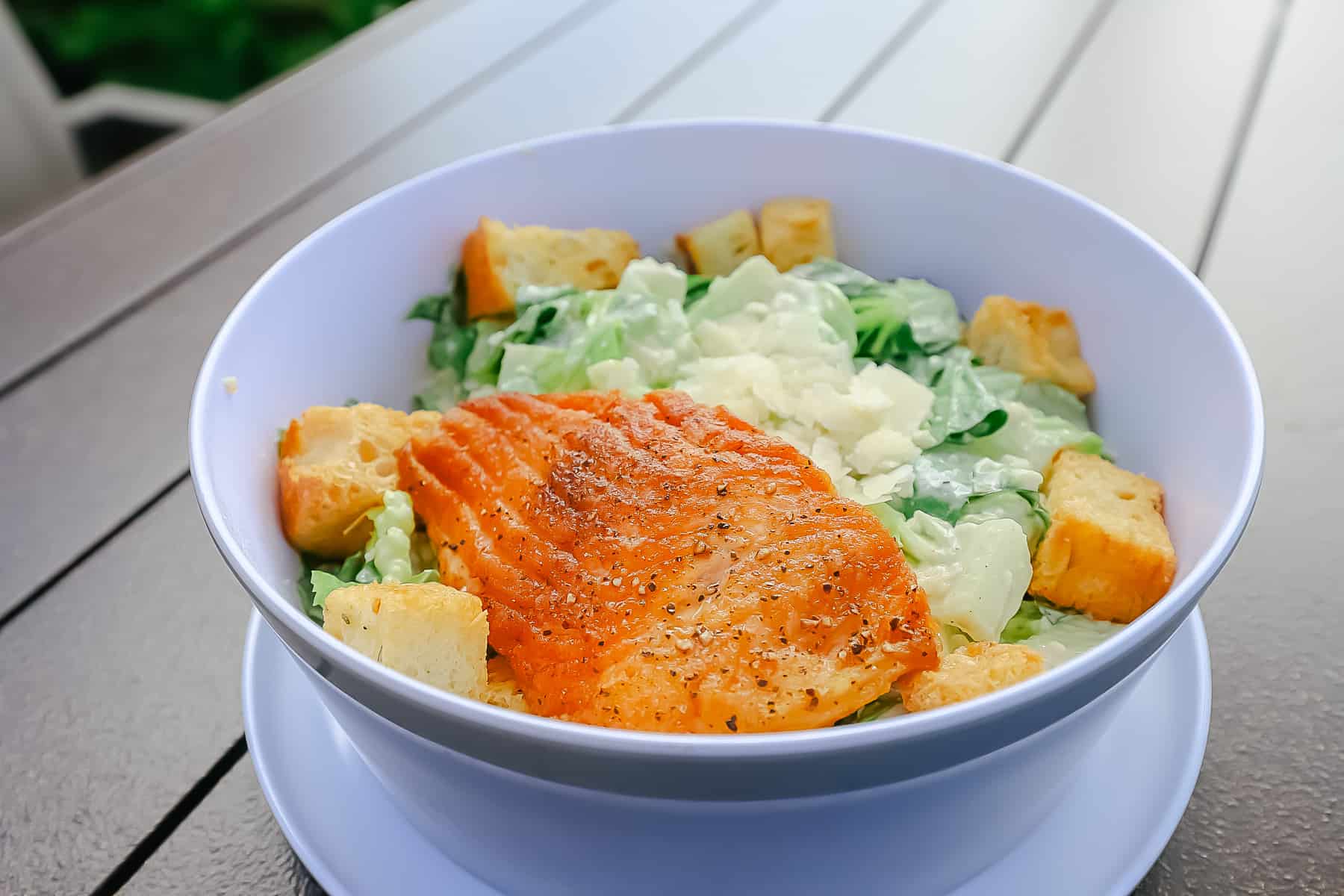 Caesar salad with grilled salmon at the pool grill at Waldorf Astoria Orlando 