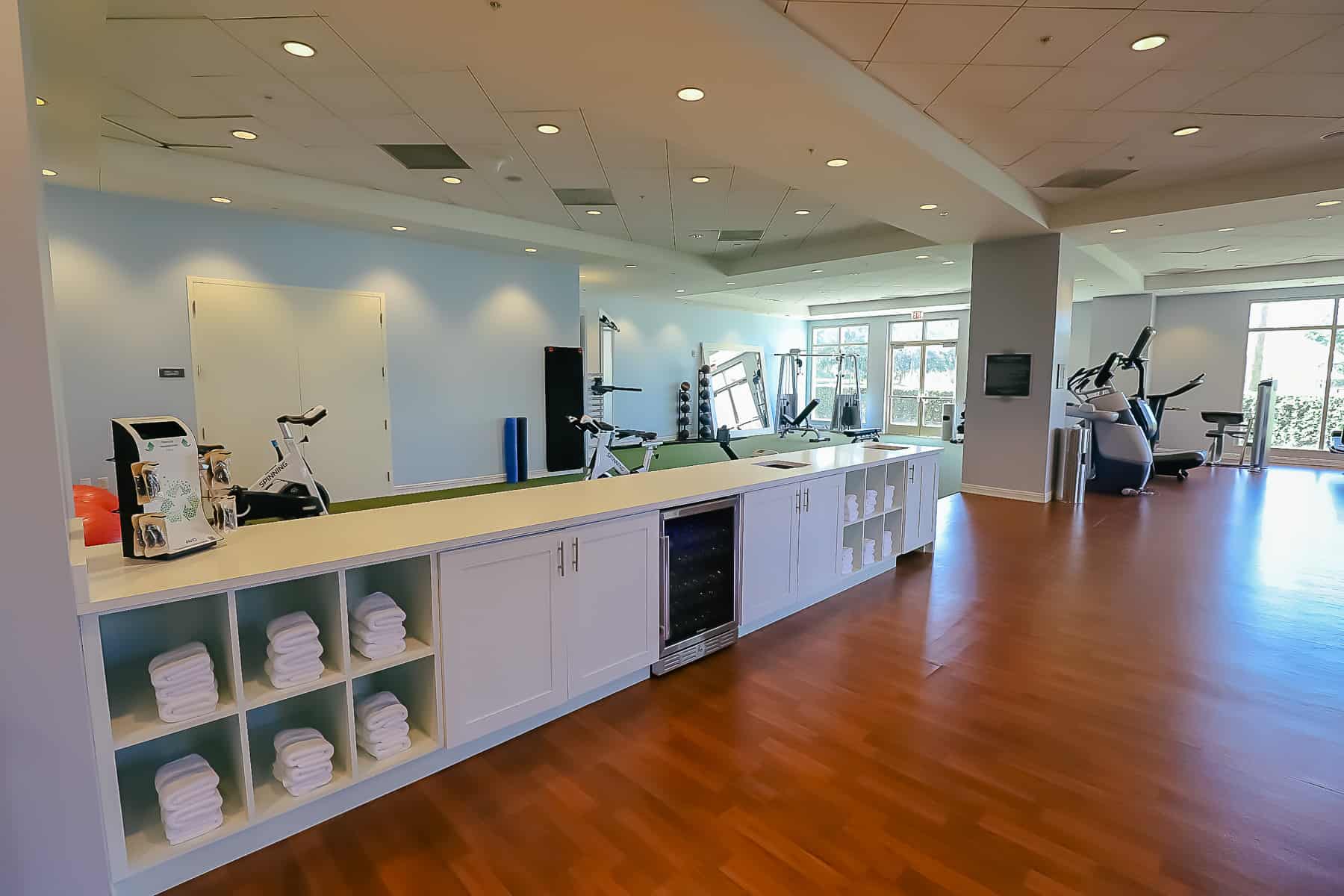 hotel gym with towels and water 