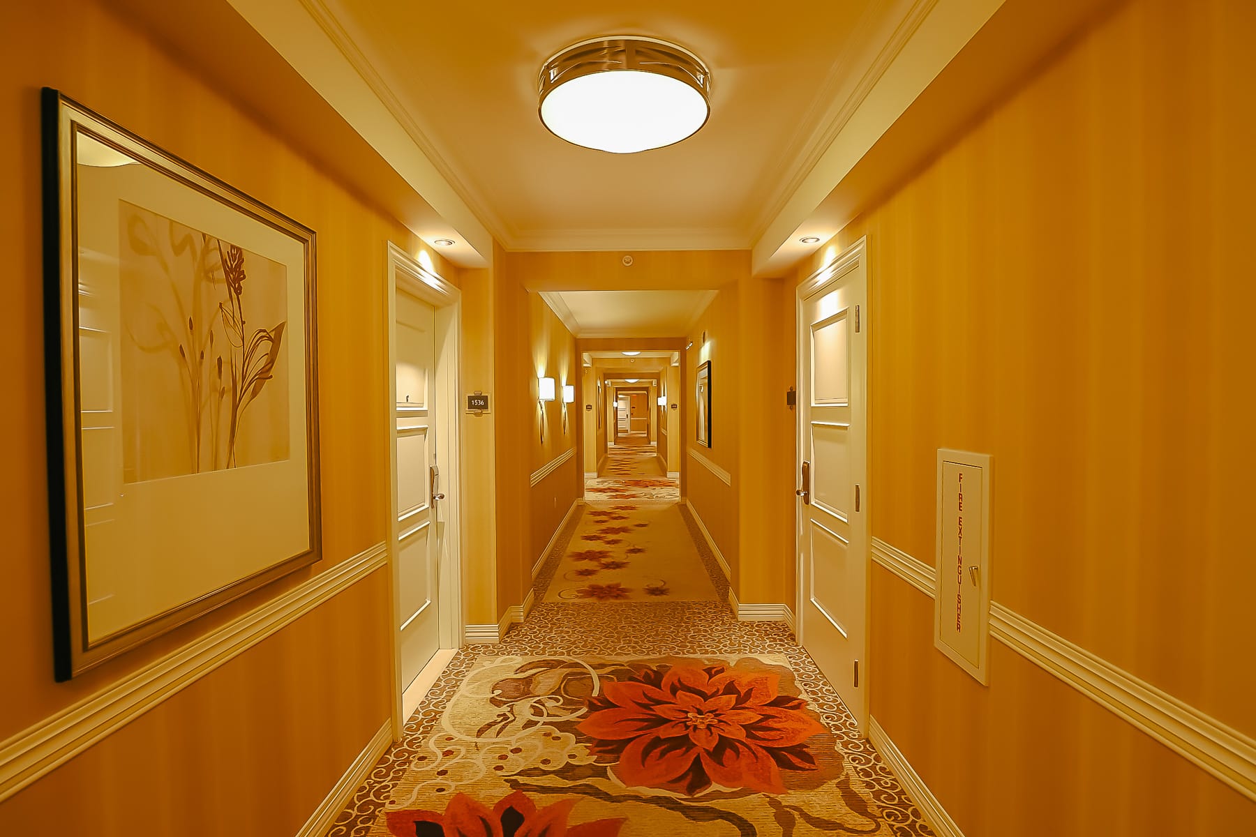 interior hallway with gold accents Waldorf Astoria Orlando 