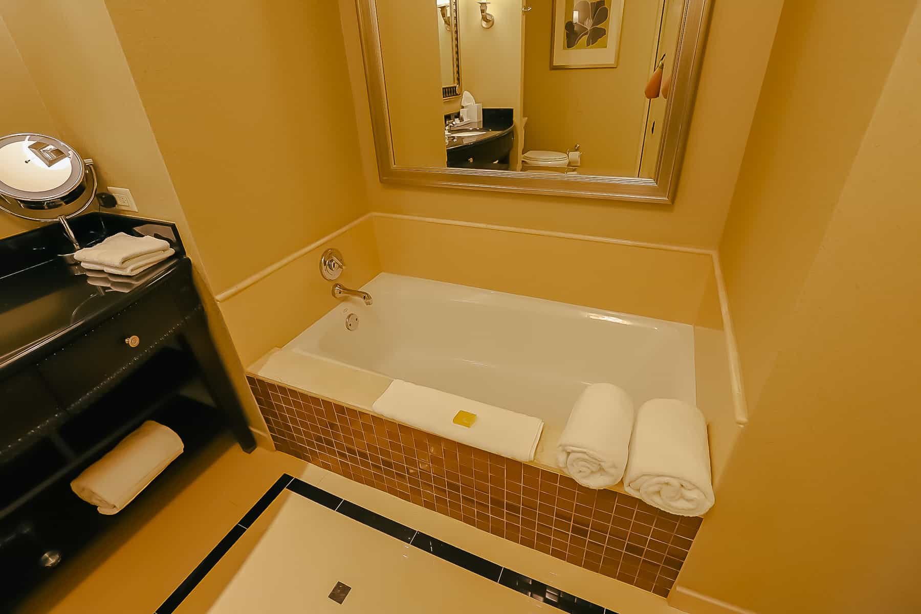 a soaking tub with oversized towels in the Waldorf Astoria Orlando bath 