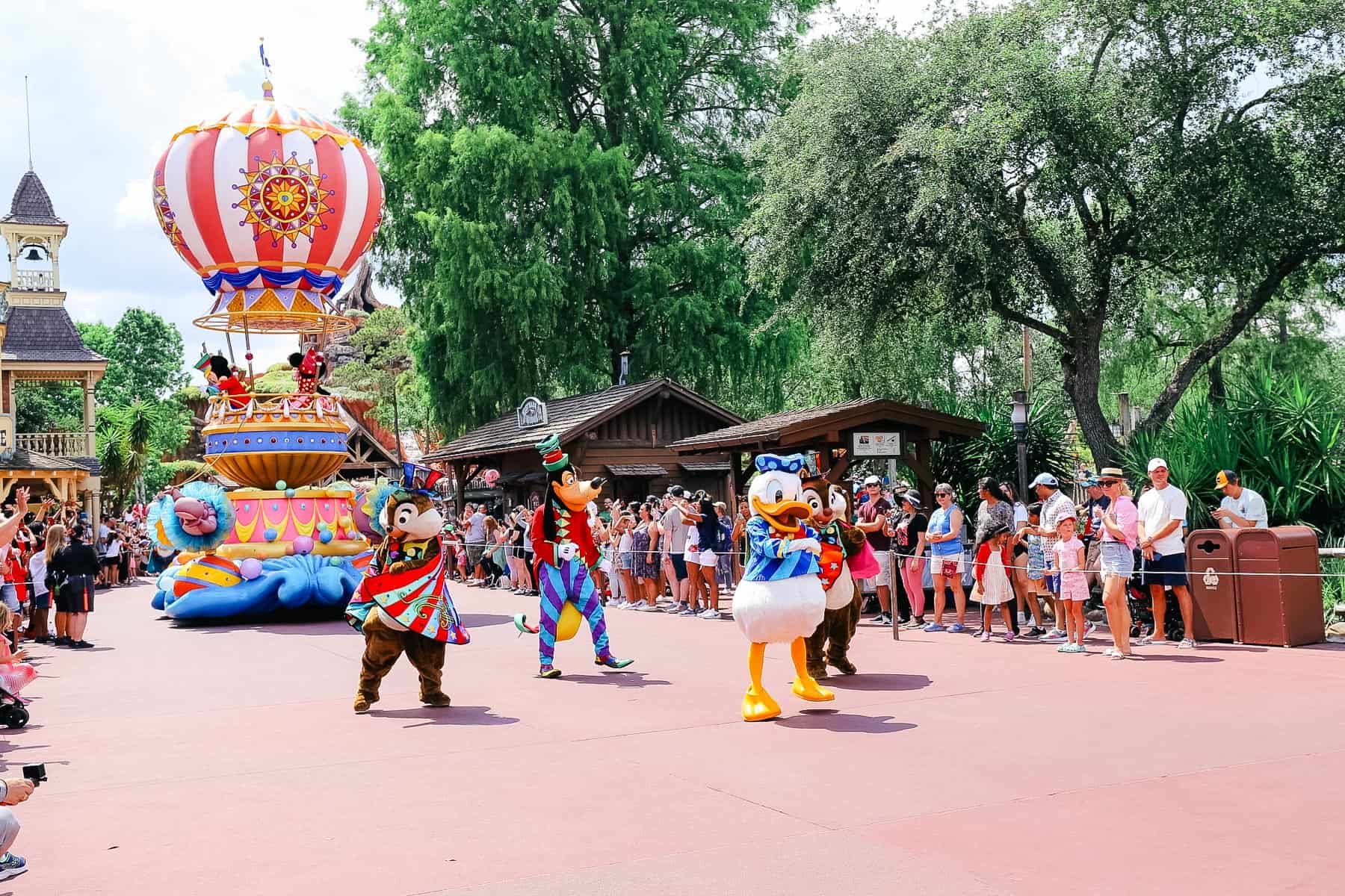 Donald Duck with other walking characters in the parade. 