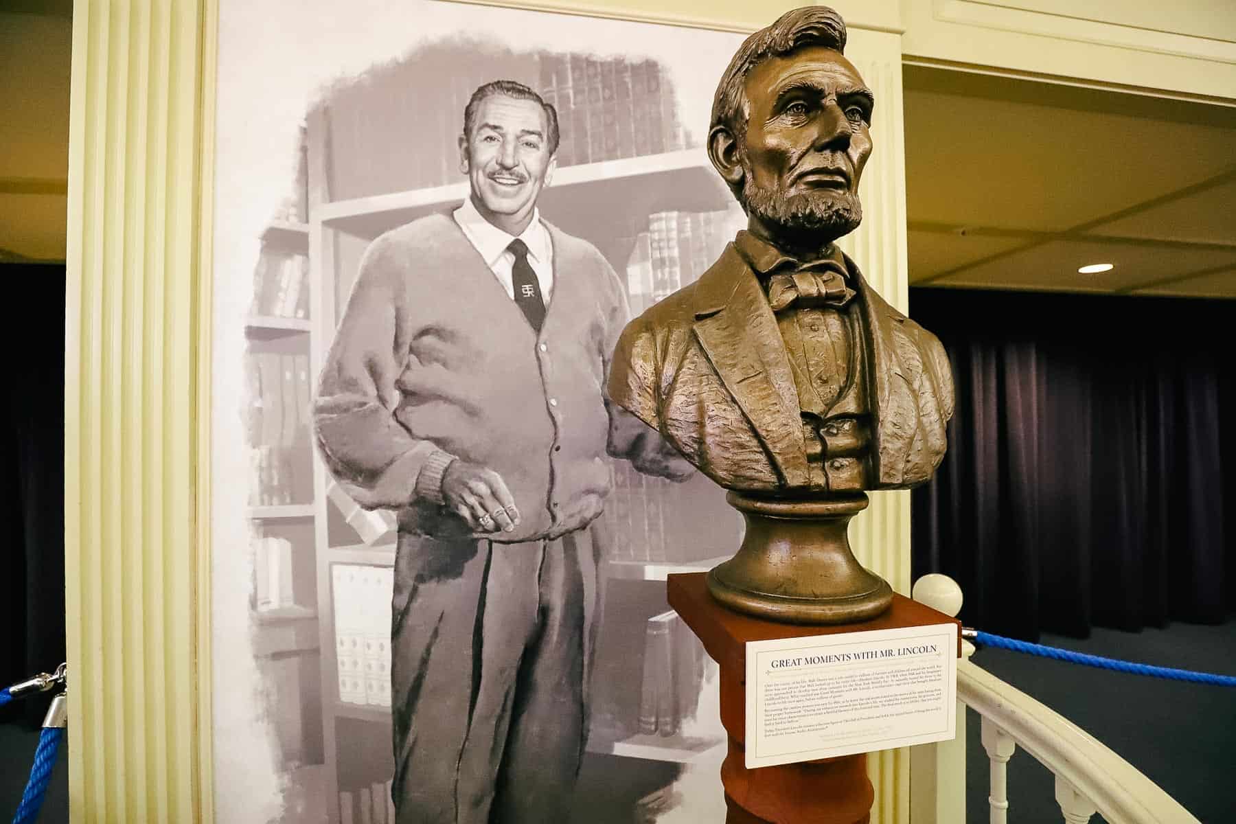 A portrait of Walt Disney with a statue of Abraham Lincoln. 