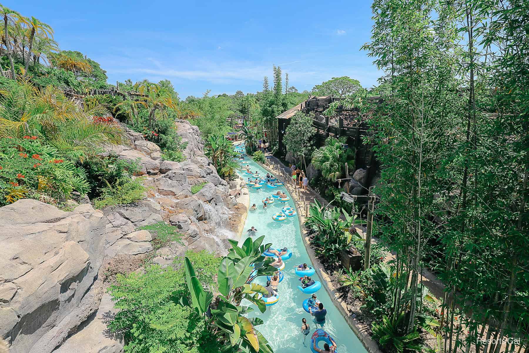 guests enjoying a lazy river at a water park 