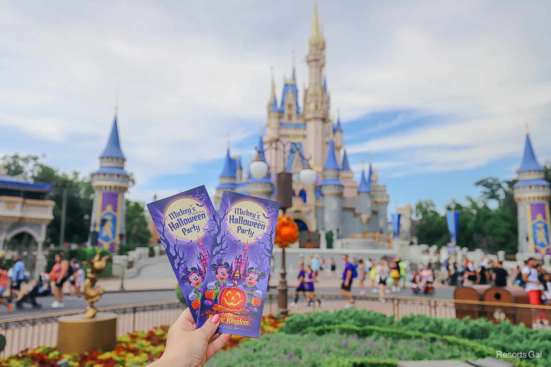 brochures held in front of Cinderella Castle for the Halloween Party 