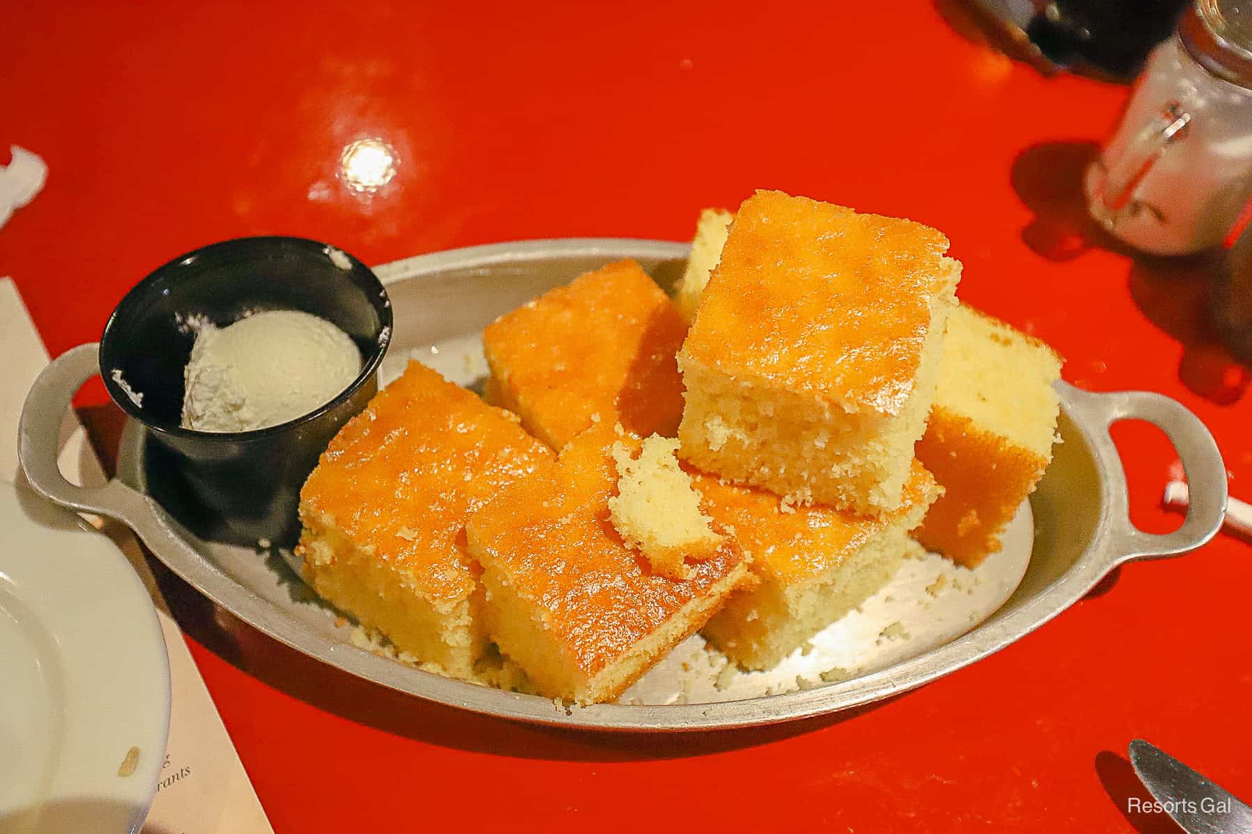 a platter with stacked pieces of corn bread 