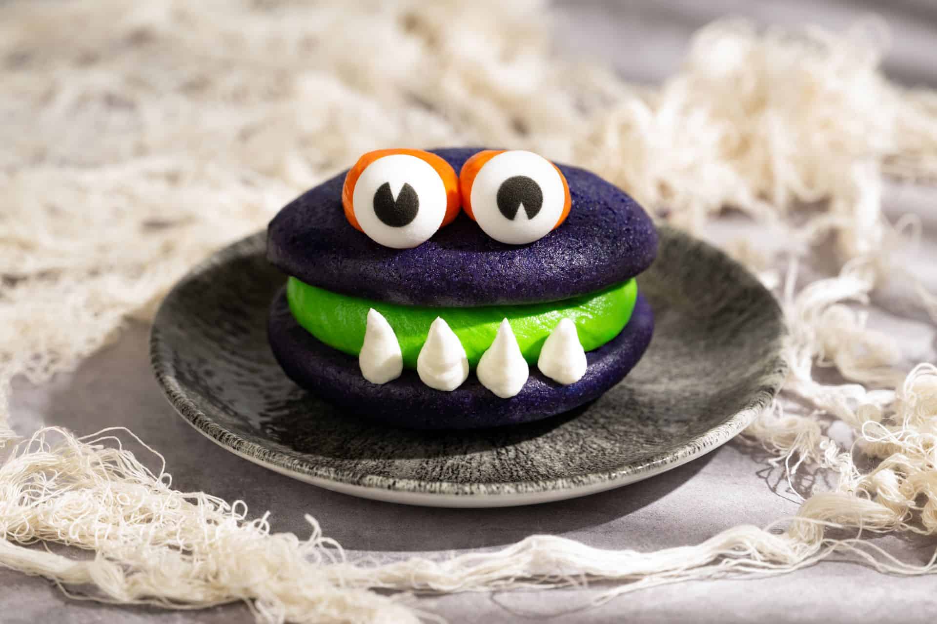 a deep purple whoopie pie with green filling