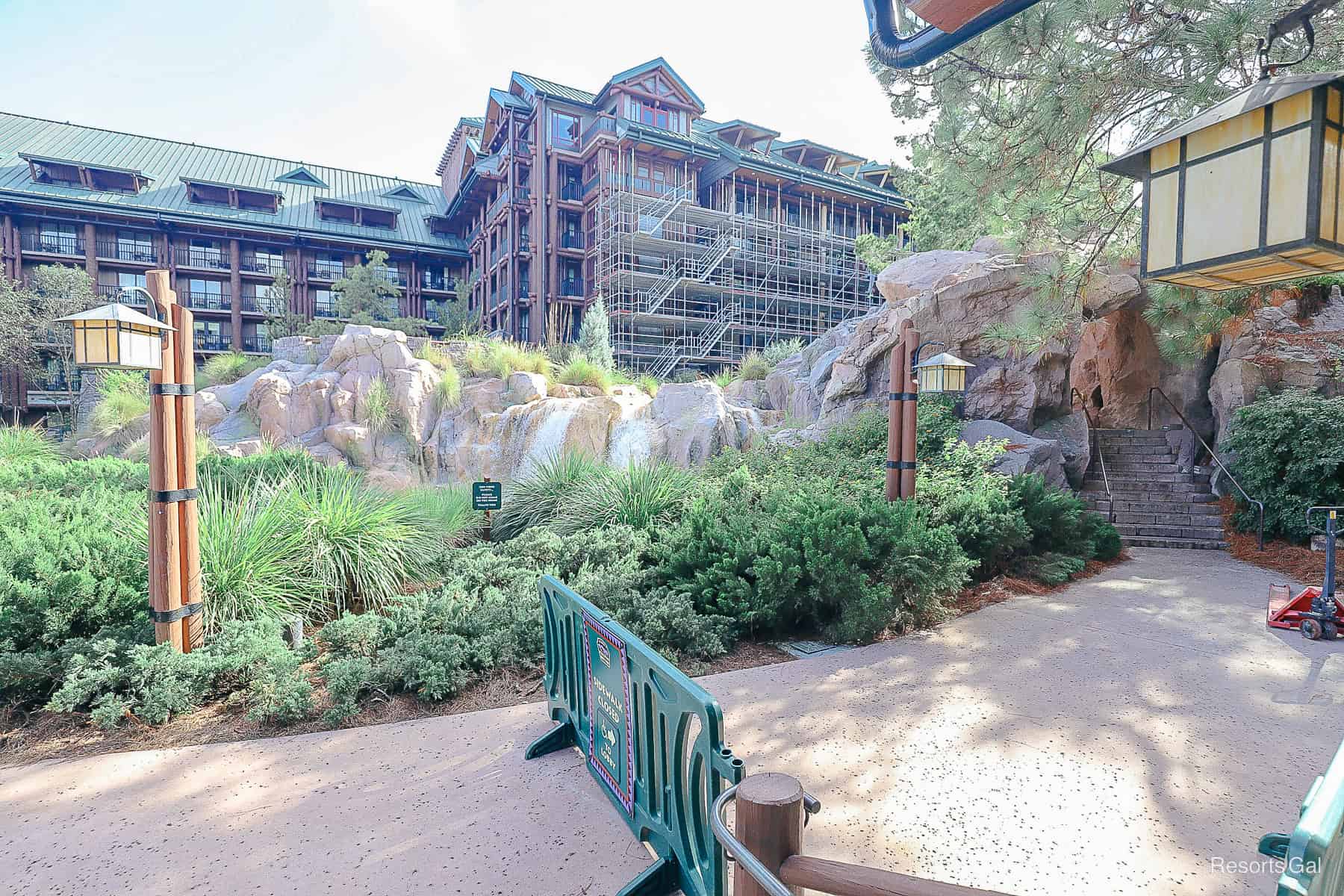 extensive scaffolding on the building behind Copper Creek Falls at Disney's Wilderness Lodge