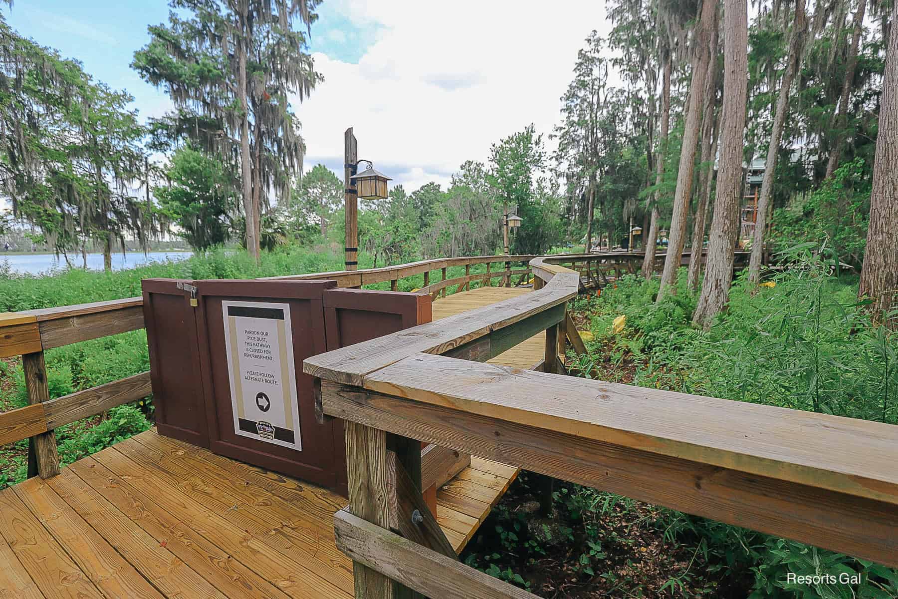 shows where the boardwalk planks are missing beyond the fence