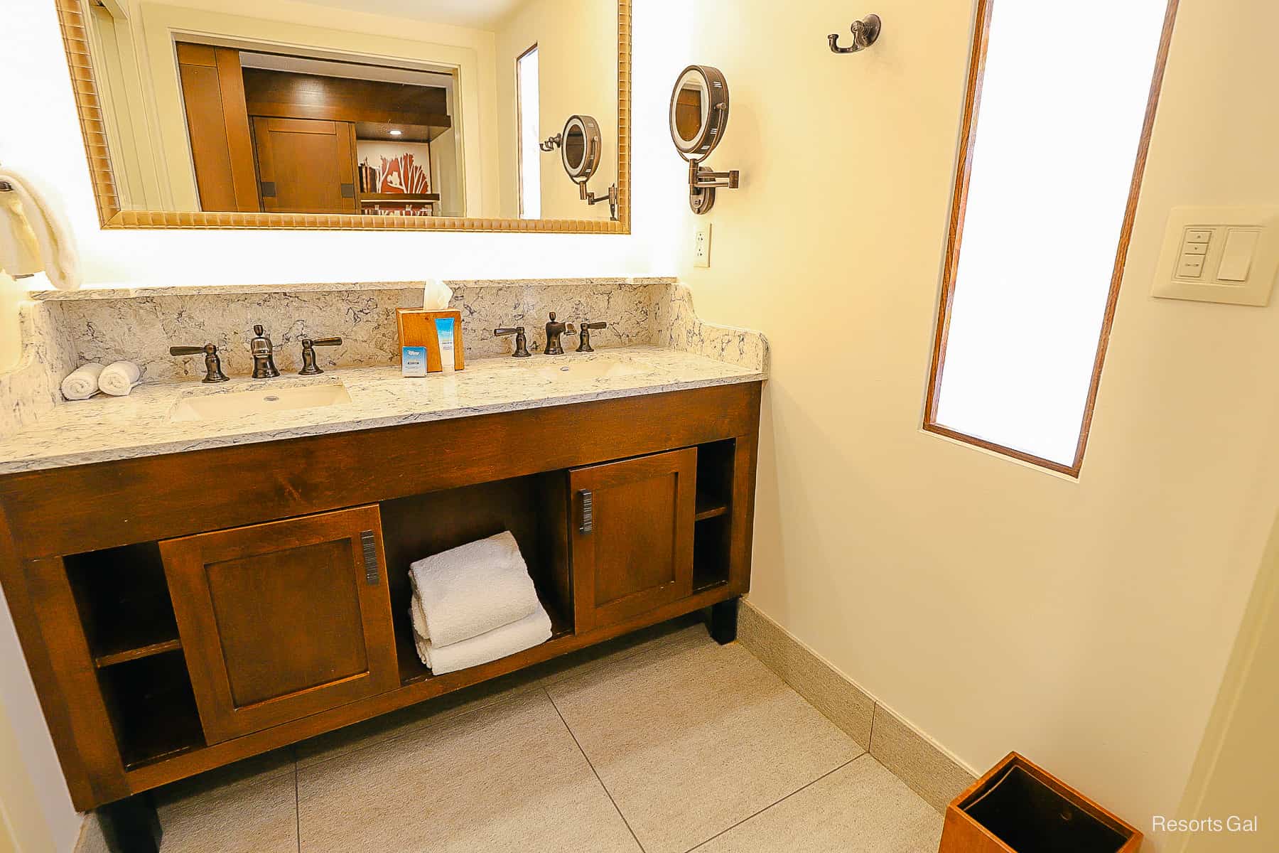 a guest bath in our hotel room at Disney's Wilderness Lodge with a vanity 