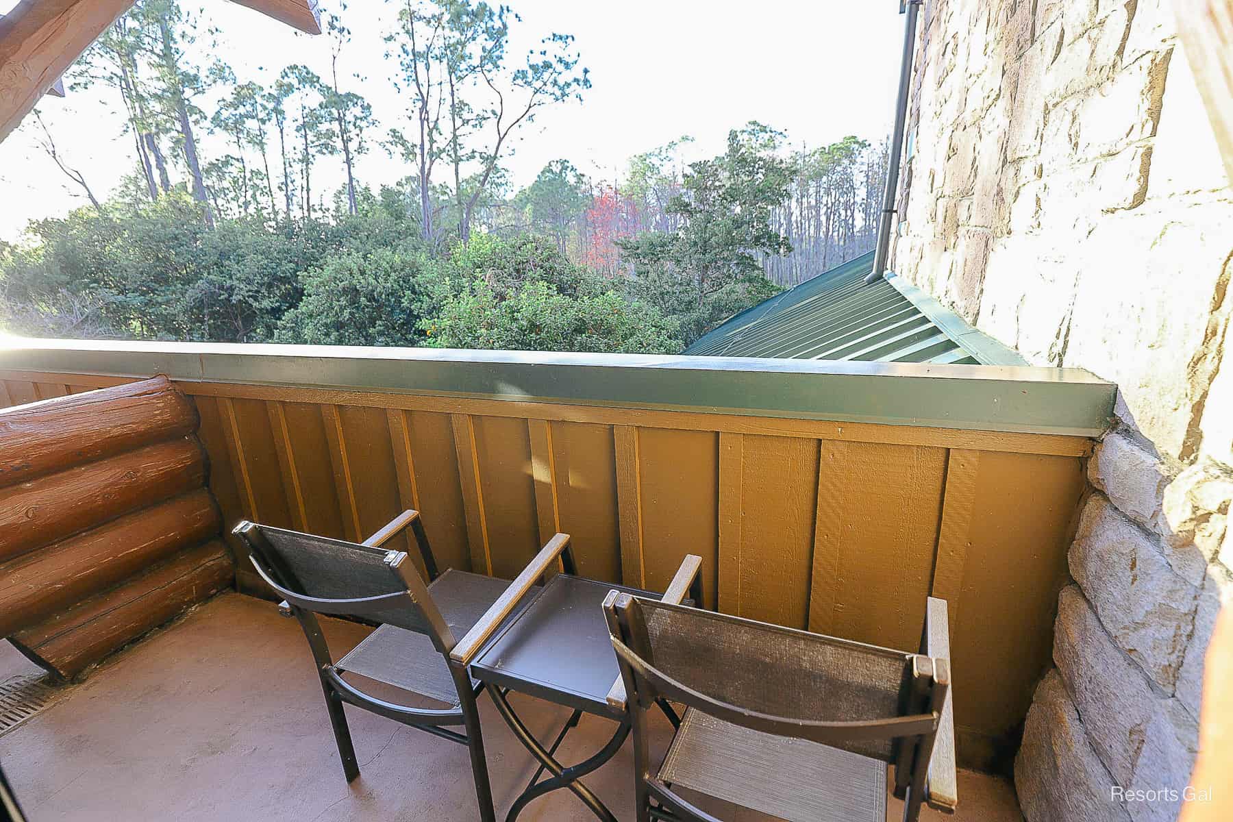 a balcony with a pretty view of the woods at Disney's Wilderness Lodge 