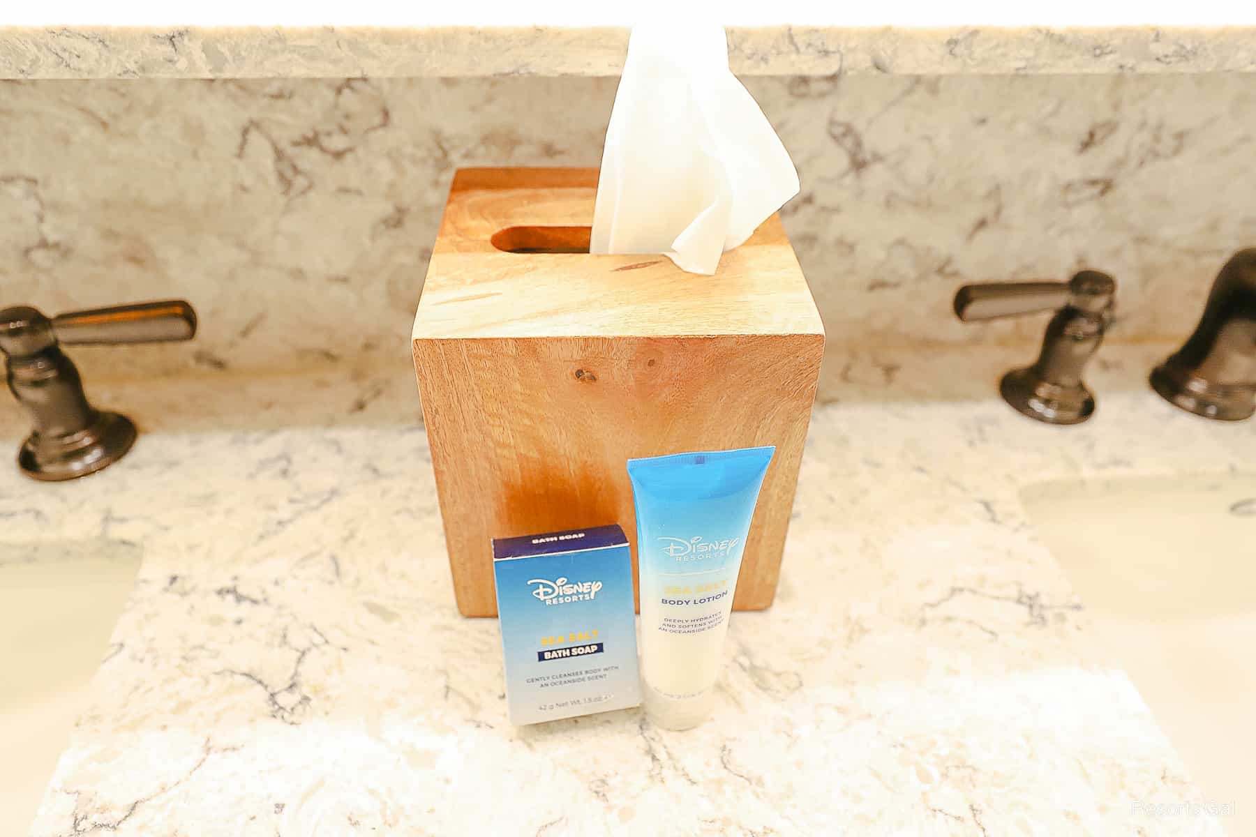 a tissue box, bath soap, and body lotion 