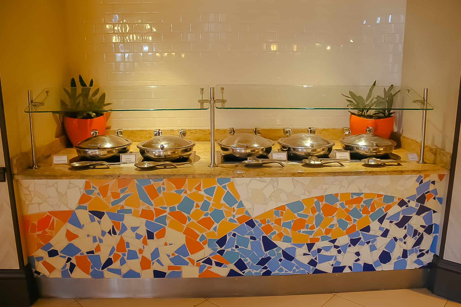 covered hot dishes on the breakfast buffet 