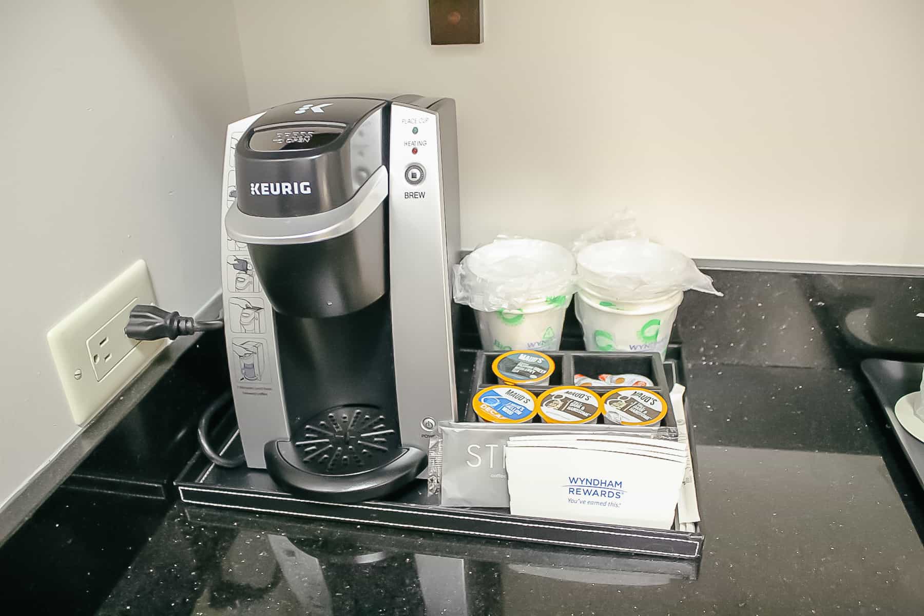 a Keurig coffee maker and accompaniments 